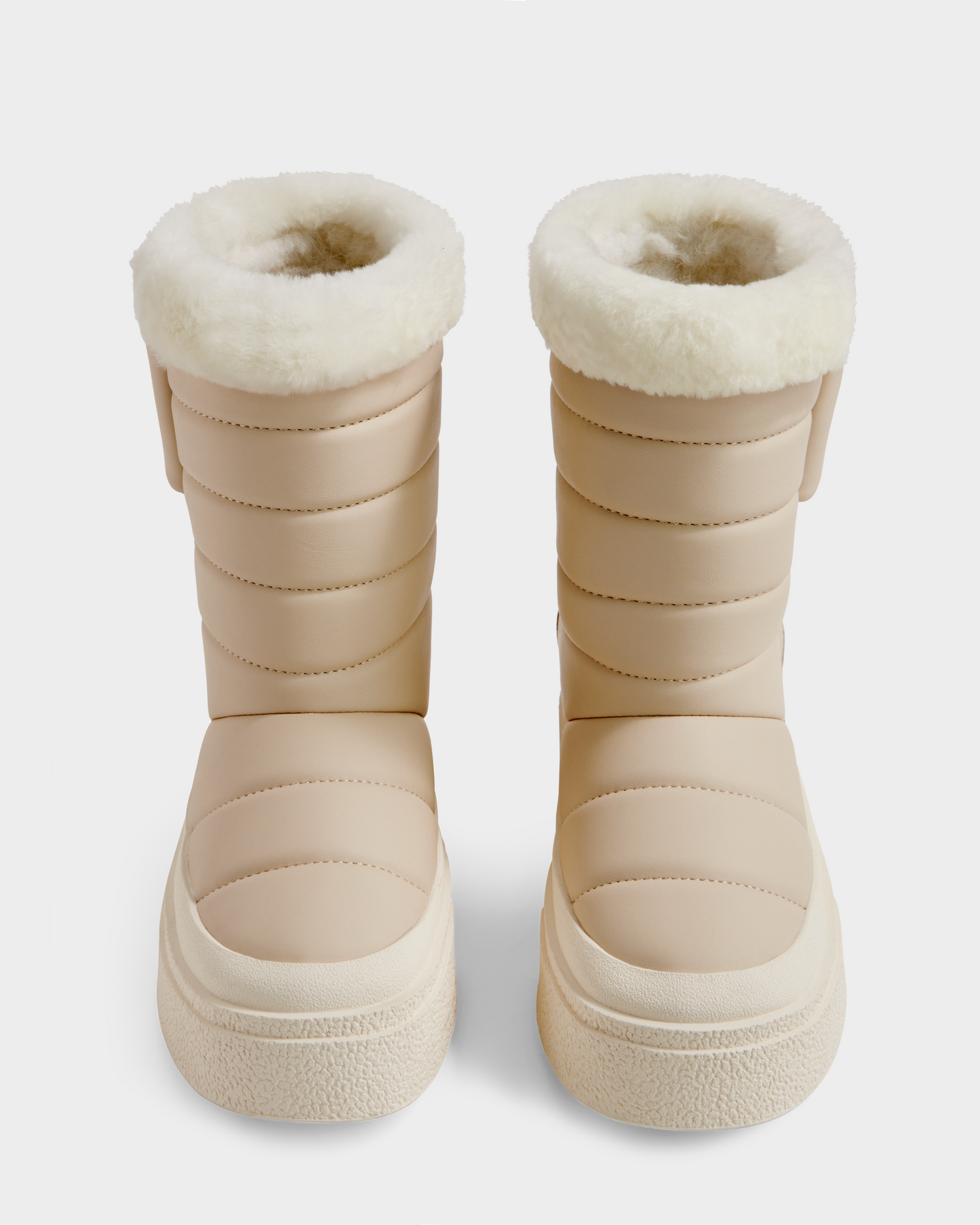The Rudsak KATHIE - L225516 Vanilla boots are beige women’s mid boots with quilted, padded uppers and white plush faux fur lining at the tops, shown from the front on a plain white background.