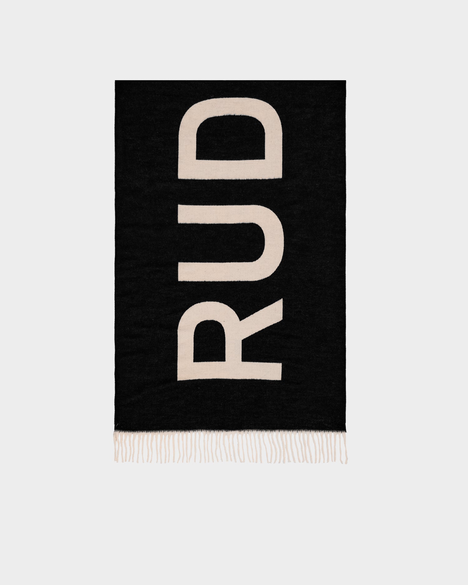 The Rudsak LEV - U425506 Black scarf features bold cream-colored letters spelling RUD vertically, white fringe at the bottom edge, and offers a stylish cold-weather accessory for any wardrobe.