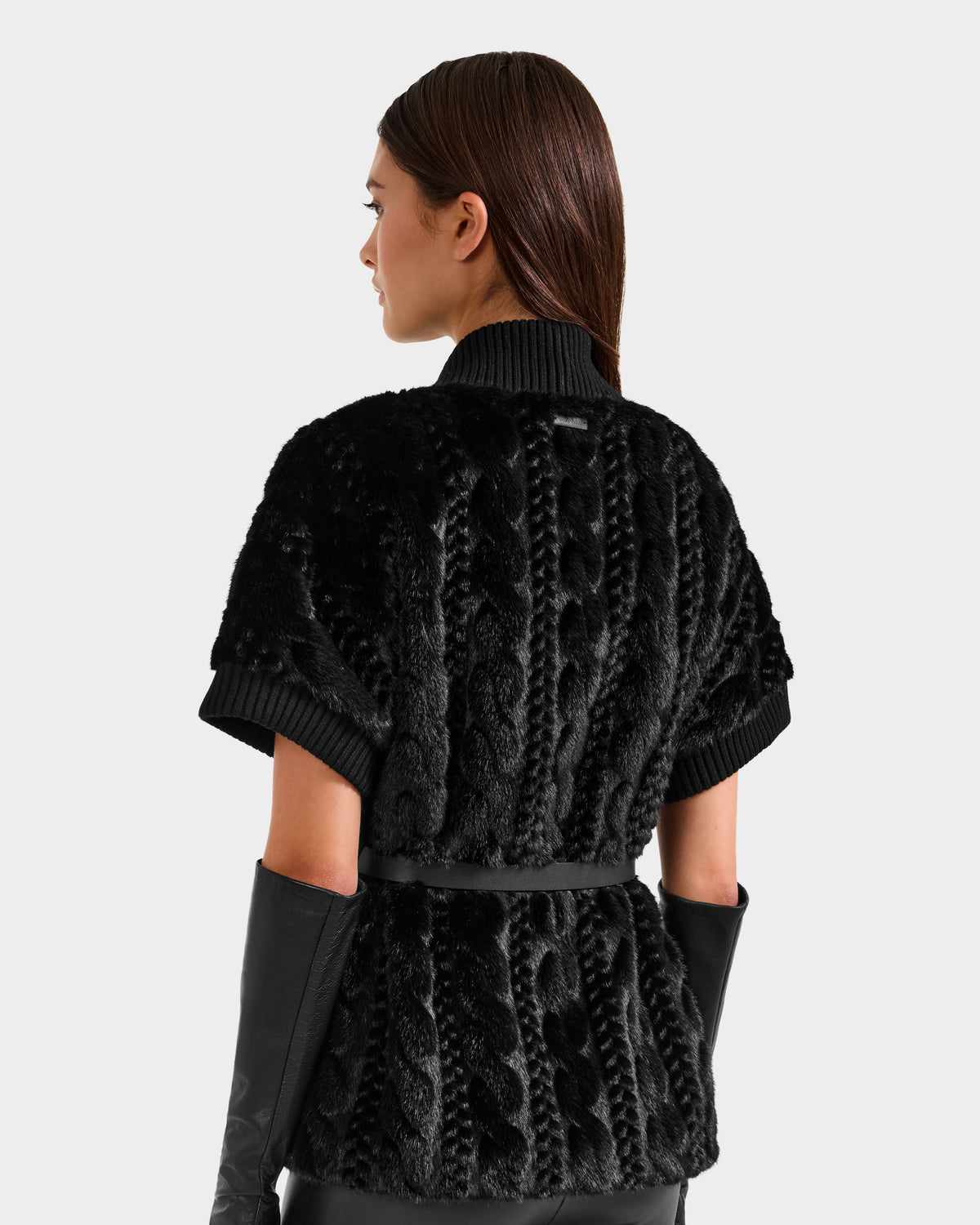 A woman wearing the Rudsak MENDOTA F - 8525561 Black sweater featuring a chic faux fur top detail.