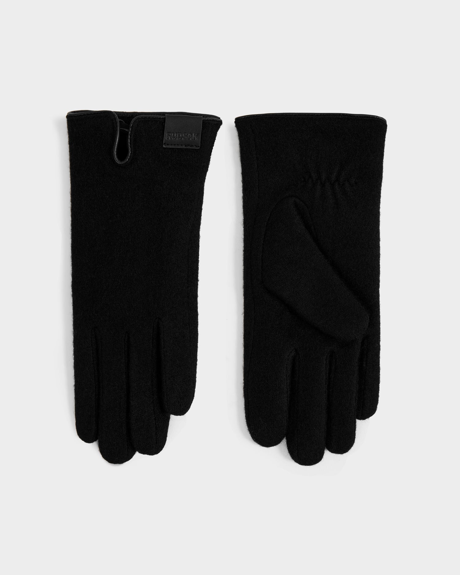 The OLGA - L425541 Black women’s wool gloves by Rudsak are shown on a light background, one displaying the palm with fine stitching and the other the back with a brand tag and wrist notch—perfect for cold weather.