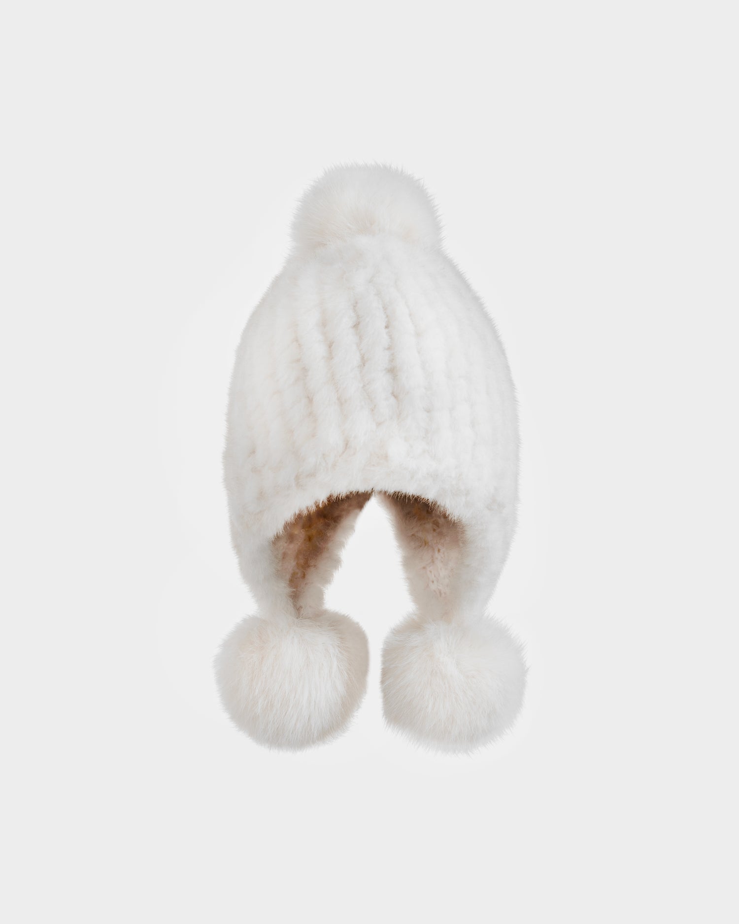 The Rudsak PIA - 8425547 Iceland women's faux fur hat features knit ear flaps and three fluffy pom-poms—one atop, one on each flap—shown against a plain white background.