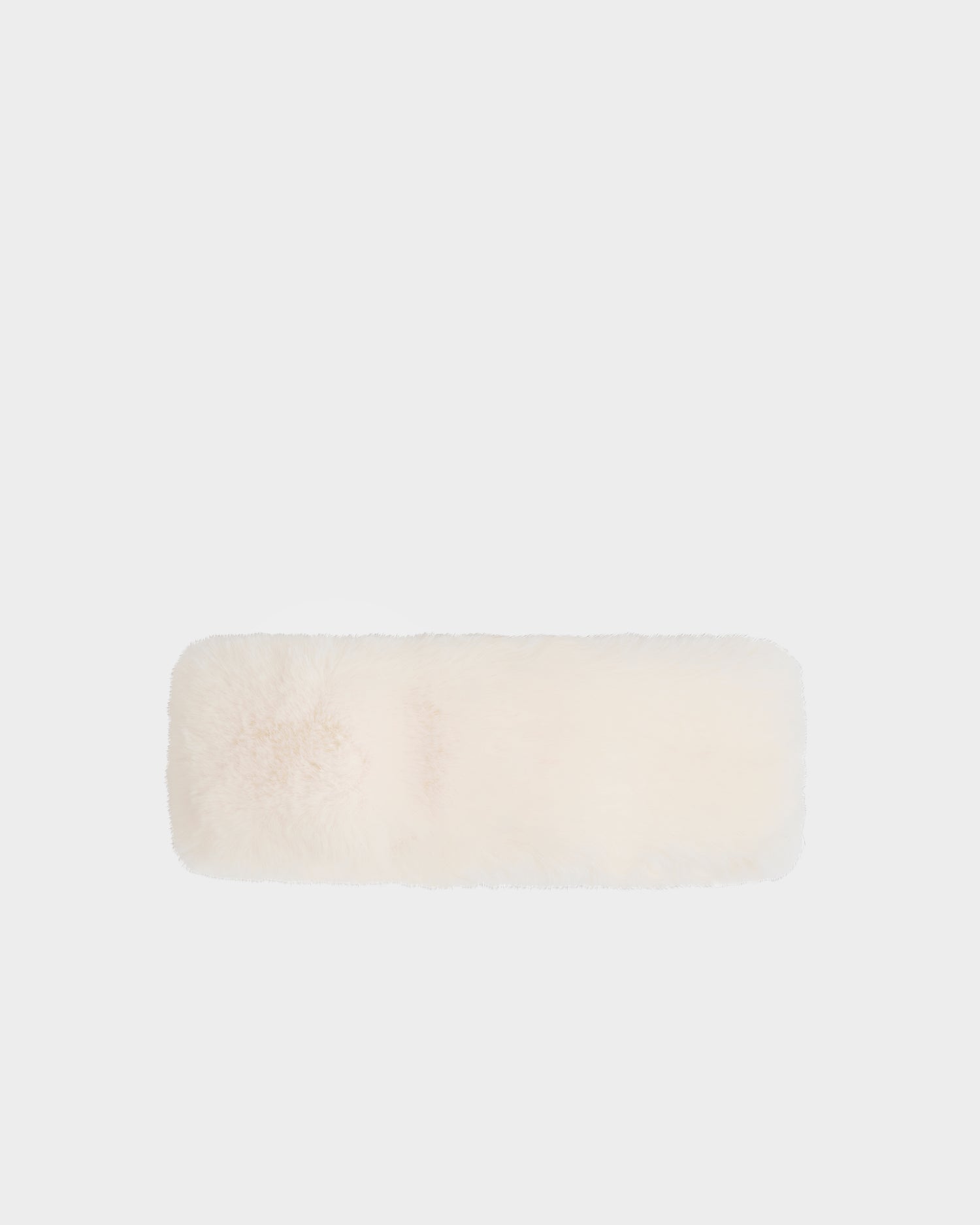 The SANDIE - L425552 Iceland by Rudsak is a rectangular, fluffy white faux fur headband for women, shown against a light gray background—a chic winter accessory ideal for cold days.
