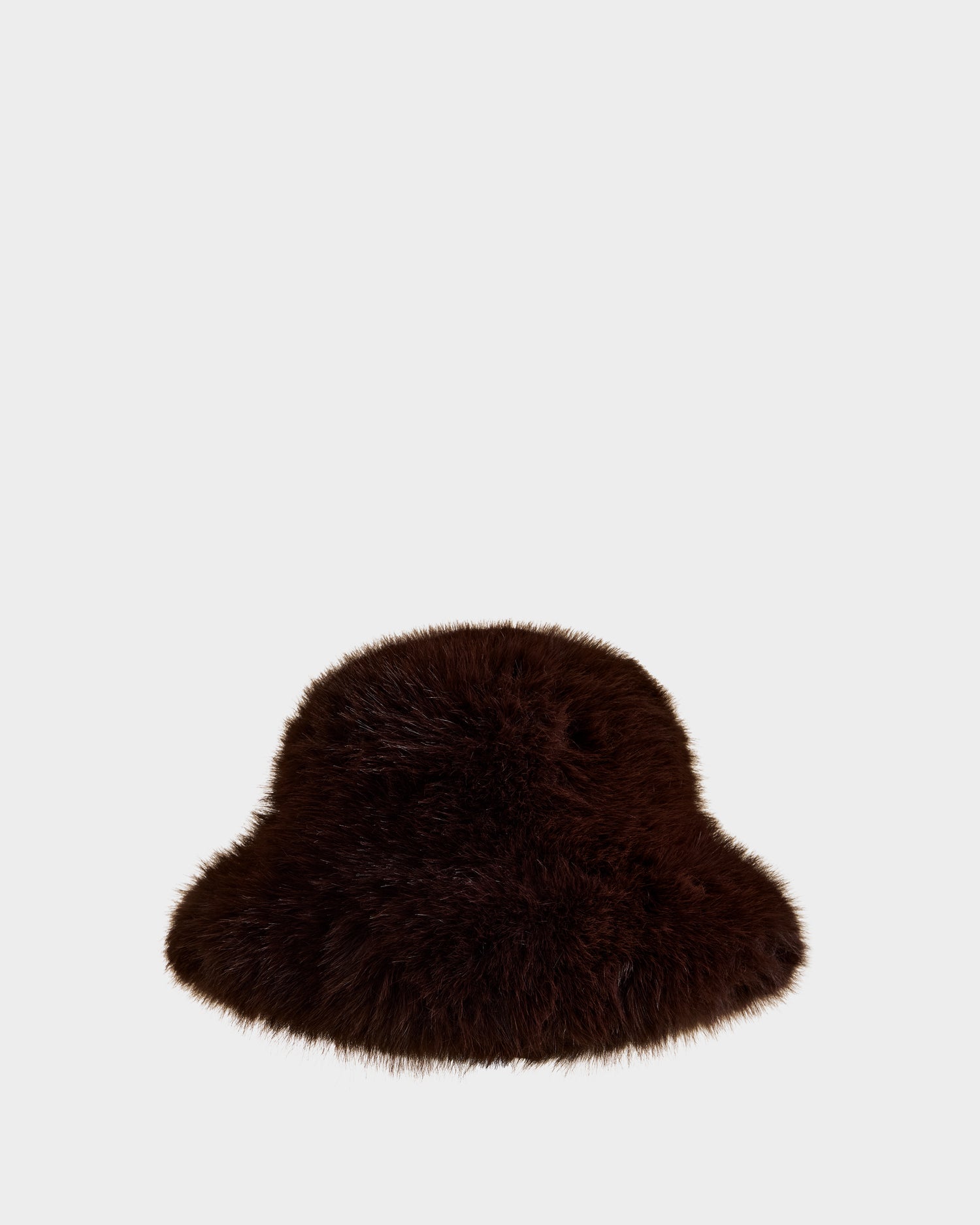 The YURI - L425538 Espresso by Rudsak is a dark brown, fluffy faux-fur women’s bucket hat with vegan-leather trim, shown against a plain light gray background—a chic winter accessory.