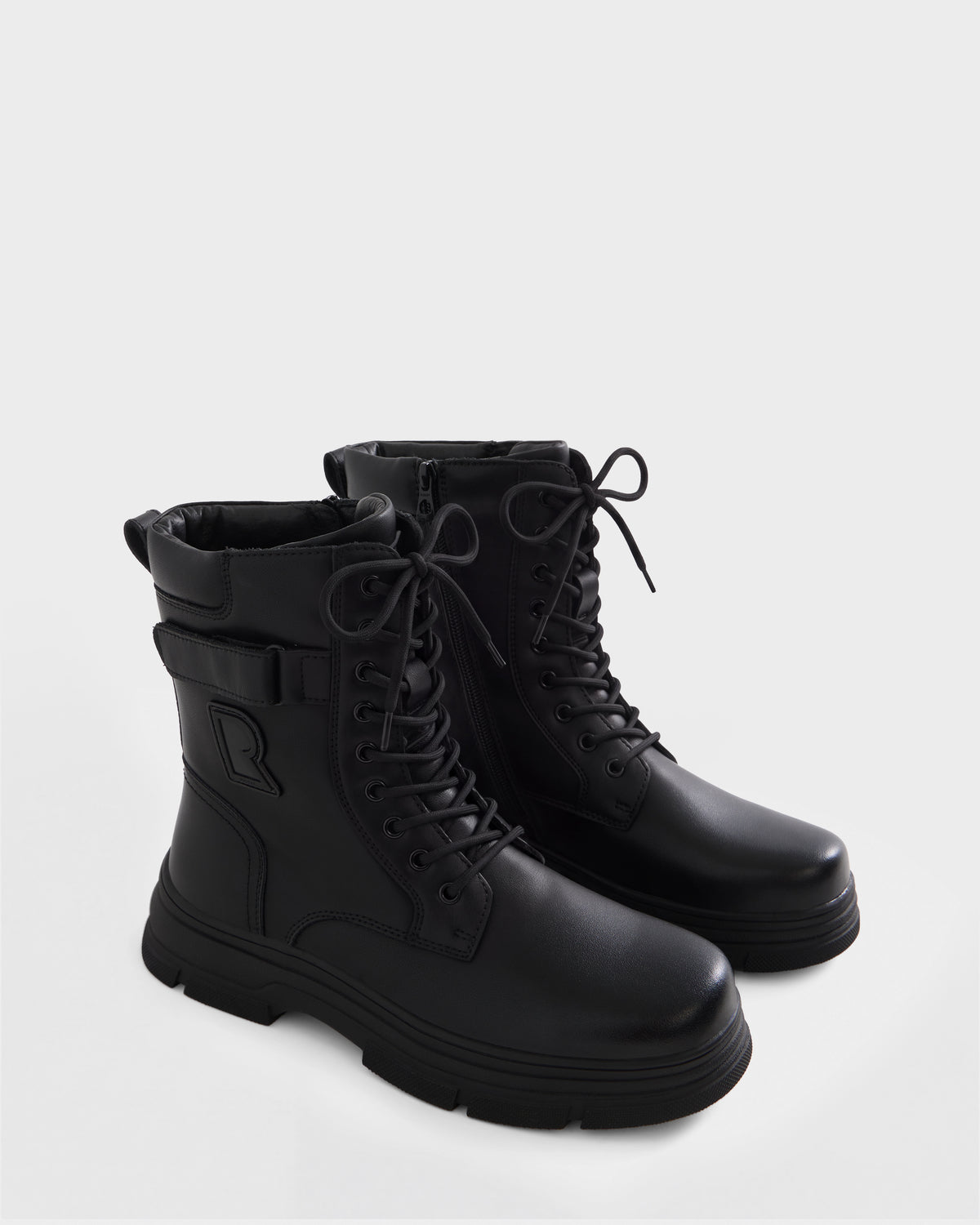 DEREK - 6226506 Black by Rudsak: black lace-up combat boots with side zippers and thick rubber soles, ideal for winter, shown on a white background.