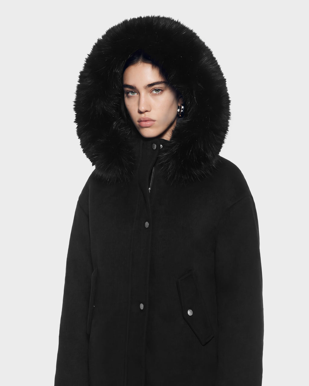 A person wearing a HAZEL - 8126981 Black wool-blend winter coat with a large, faux-fur trim hood.
