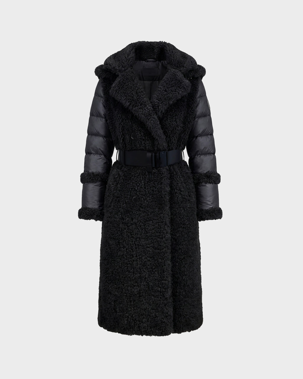 The Rudsak NOELLE - 8126971 Black is a long black faux fur coat featuring a textured, fuzzy body, padded sleeves, a wide collar, and a matching belt at the waist. Displayed against a plain light gray background, this stylish women’s winter coat offers both warmth and elegance for the colder months.
