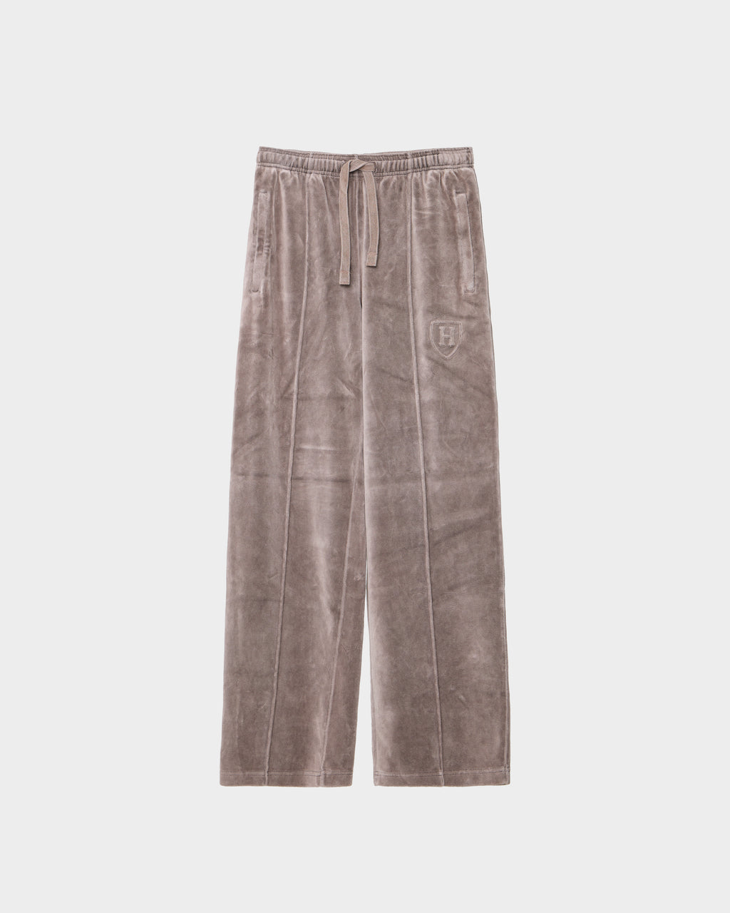Taupe wide-leg OLIVYA HV - H526903 track pants featuring an embroidered crest logo on the upper left leg, a drawstring waistband, and side pockets in a Rudsak Harvard-inspired design.
