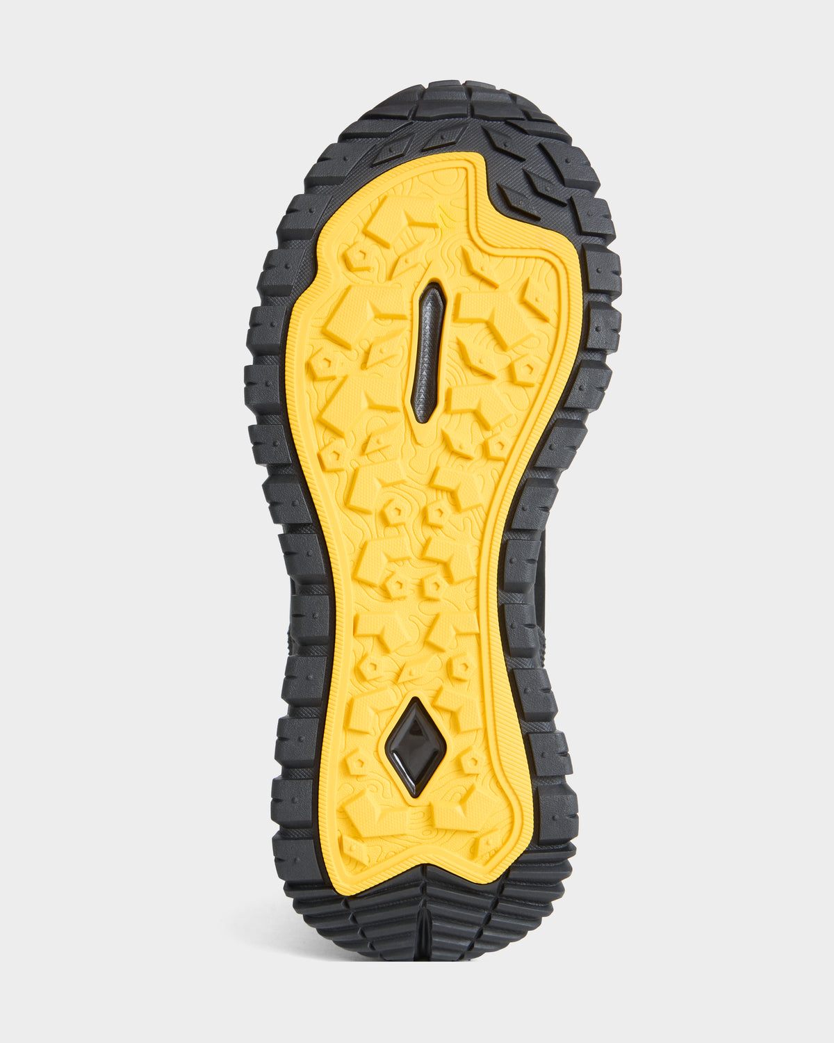 The image shows the black and yellow textured sole of the REXON - 6226503 Black boot by Rudsak, featuring a rugged, geometric tread pattern designed for traction—perfectly capturing Rudsak’s signature fusion of style and performance.