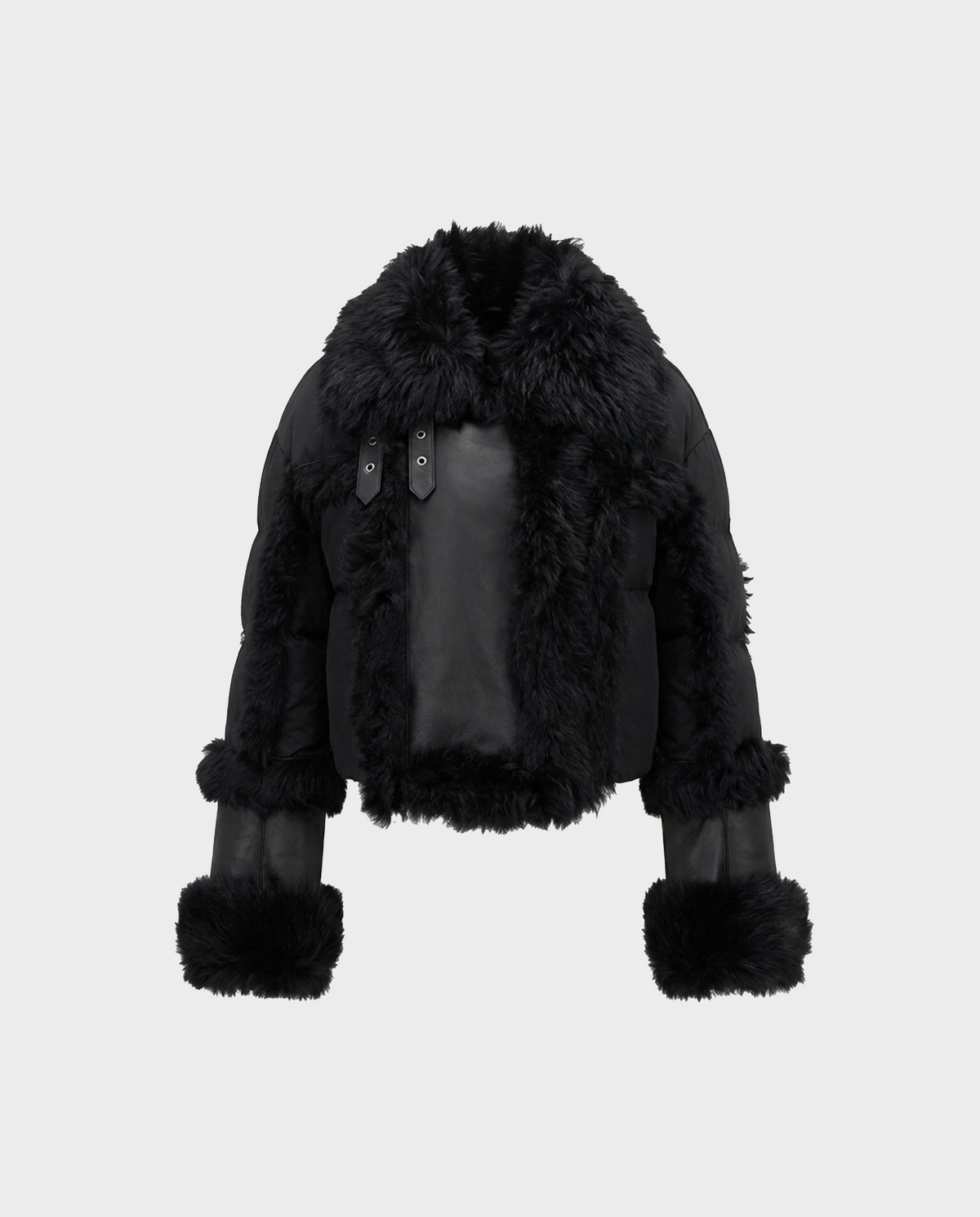 The ZELAIA - 8125577 Black by Rudsak is a black faux fur jacket featuring a cropped cut, large fluffy collar, and faux-fur detailing on the sleeves and hem, displayed on a plain white background.