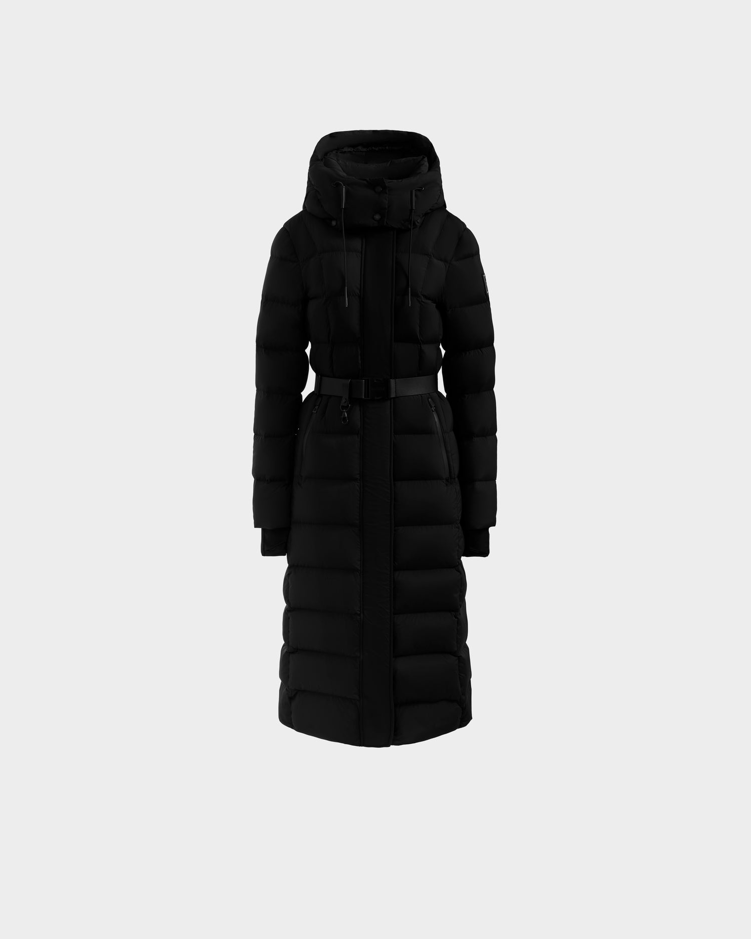 The Rudsak FRIDA M-L - L125608 Black is a women’s long quilted puffer coat with RDS-certified down fill, removable belt, hood, front zipper, and two chest pockets, shown against a plain light gray background.