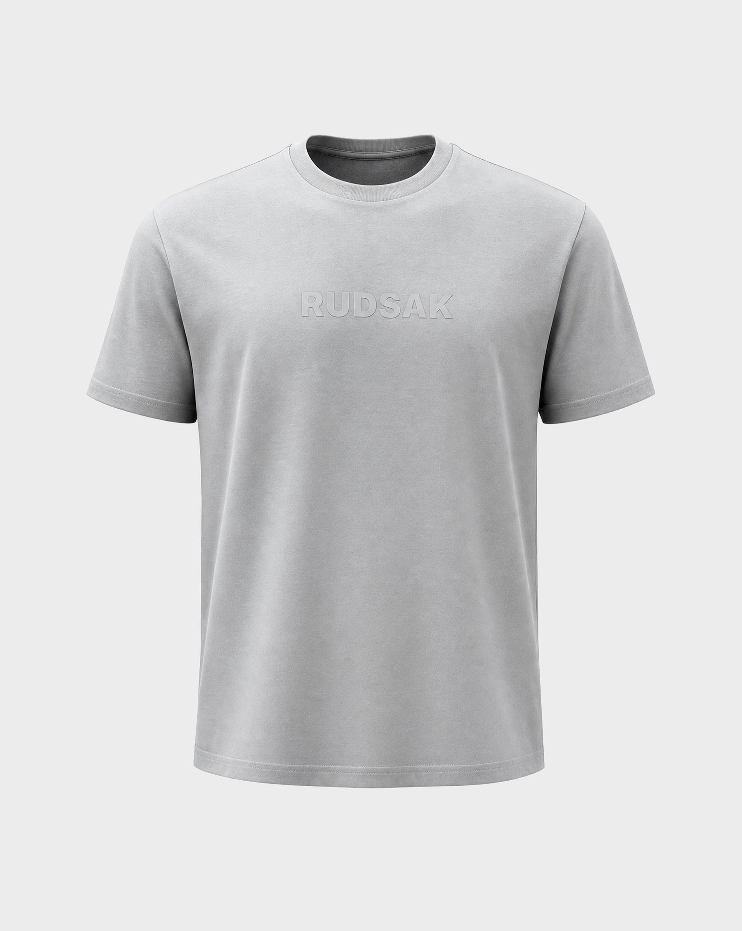 The FERDI - 6522005 Mushroom by Rudsak is a light grey short-sleeve crewneck t-shirt with "RUDSAK" subtly embossed on the chest, shown against a plain white background.