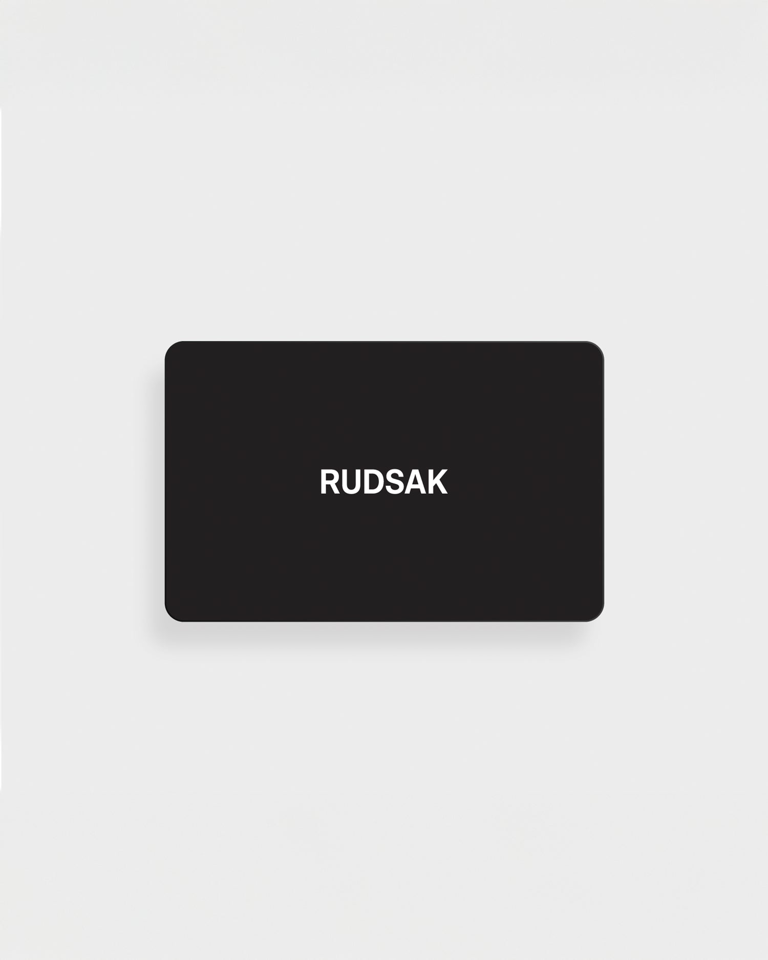 A black rectangular VIRTUAL GIFT CARD by Rudsak International features the white "RUDSAK" logo, centered on a plain white background. Enjoy email delivery and no expiration for maximum convenience.