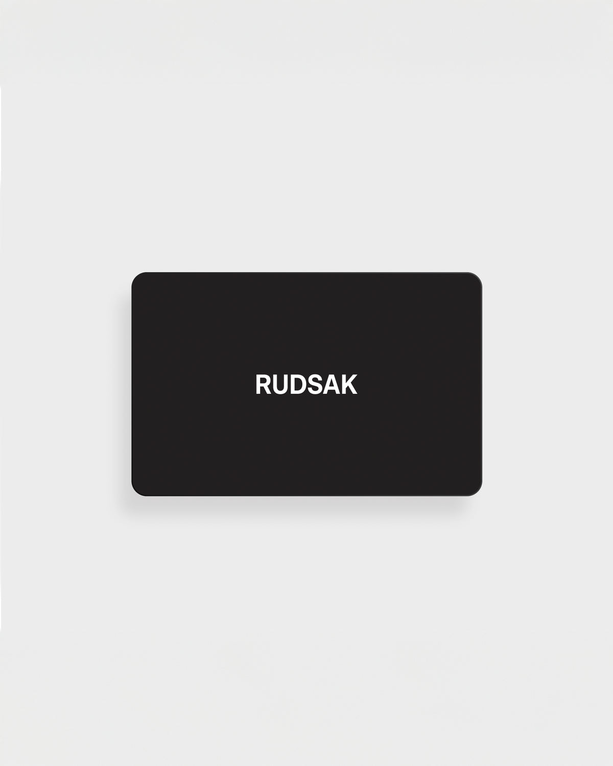 A black rectangular VIRTUAL GIFT CARD by Rudsak International features the white "RUDSAK" logo, centered on a plain white background. Enjoy email delivery and no expiration for maximum convenience.