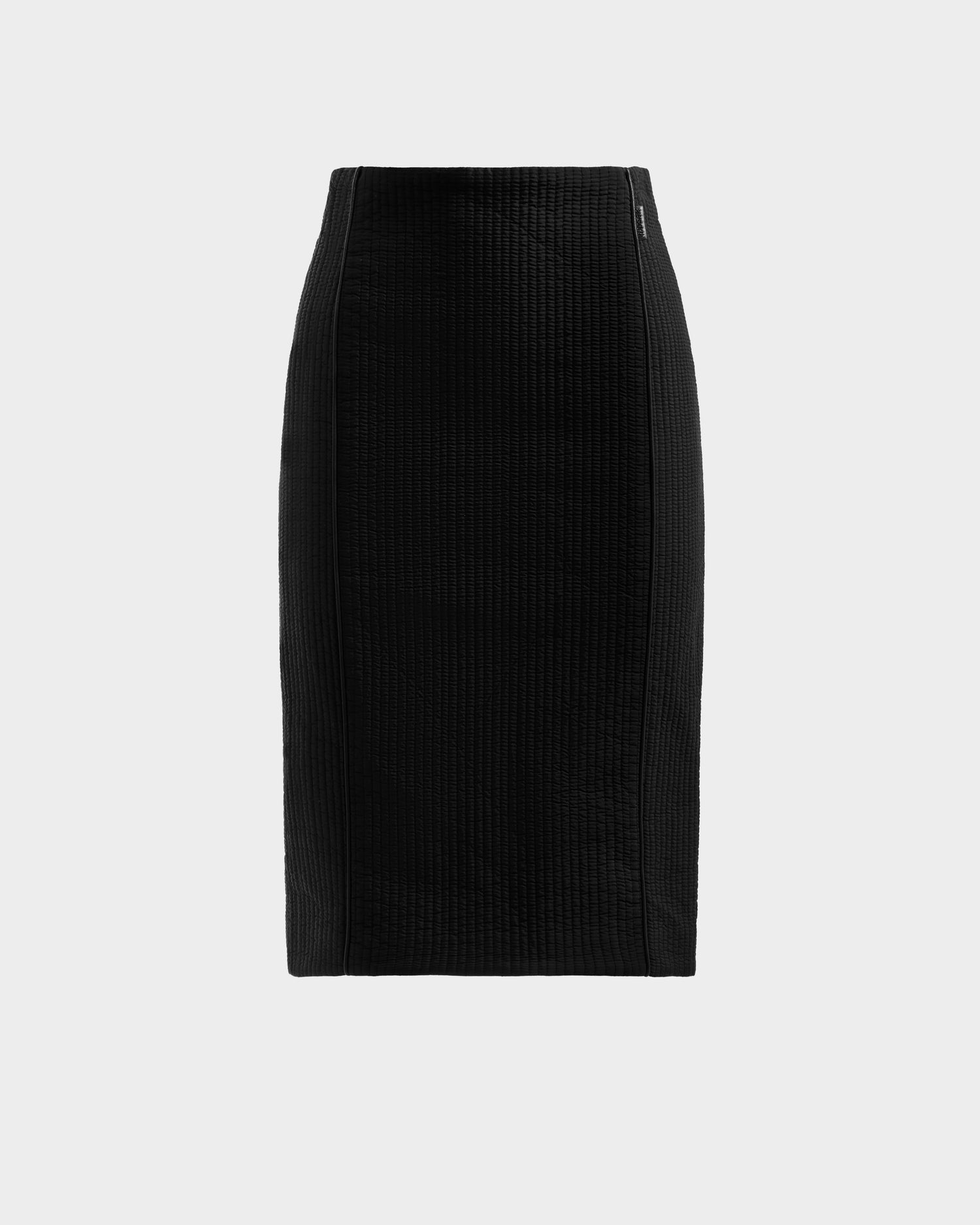 The Rudsak GLENDORA - 8525563 Black is a high-waisted, knee-length vegan leather women’s skirt with a quilted, straight fit and seam details, shown on a plain light gray background.