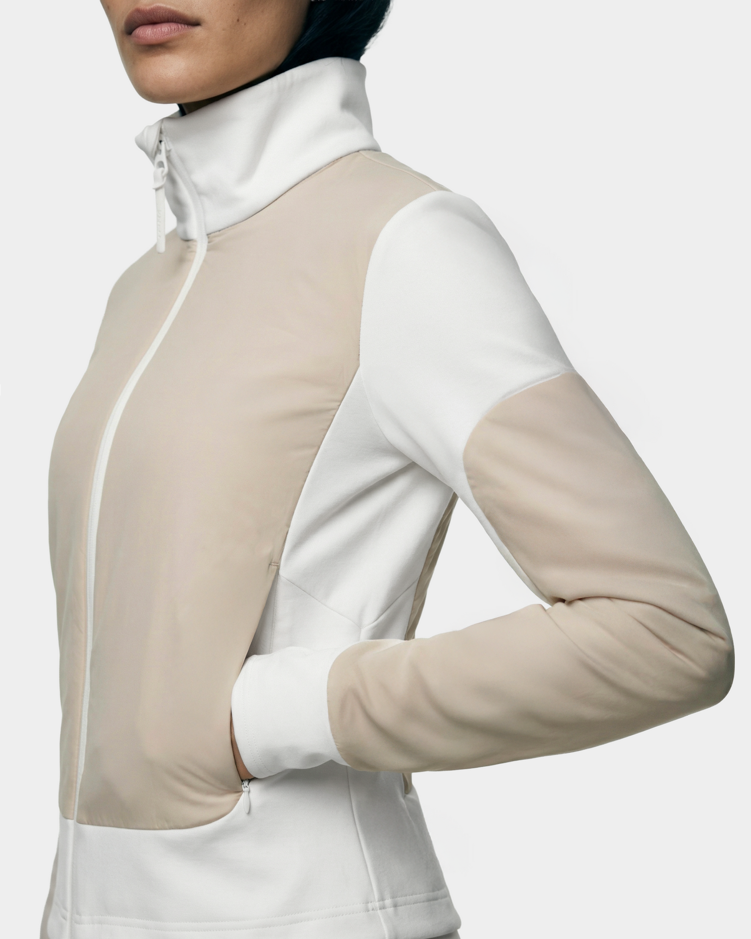 A person wearing the Rudsak GRANADA - 8126023 Vanilla sporty-chic sweater jacket with hands in side pockets, shown from chest to hips against a plain background.