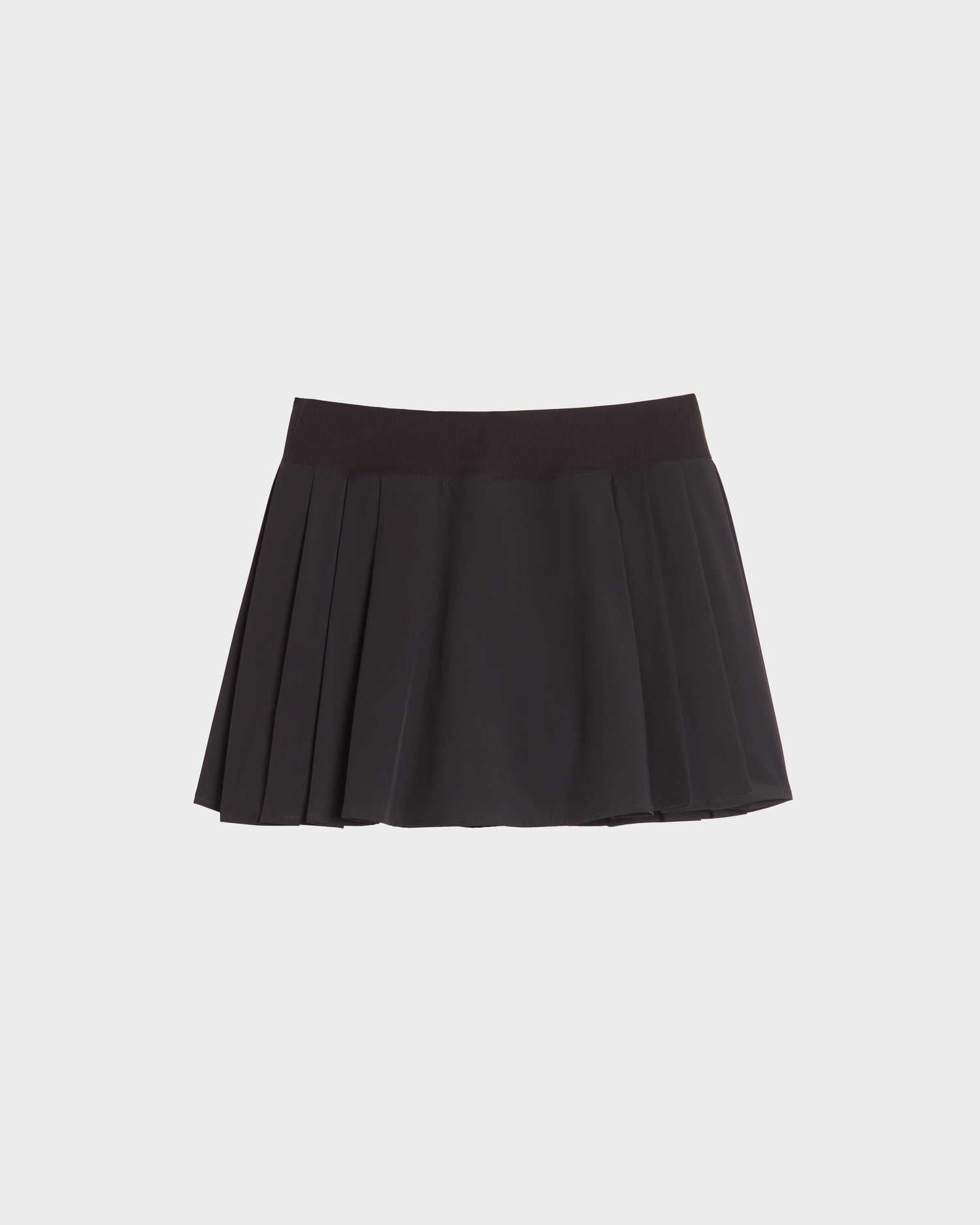 The HILDA - 8524034 Black pleated tennis skirt by Rudsak features a wide waistband and is displayed against a plain white background.