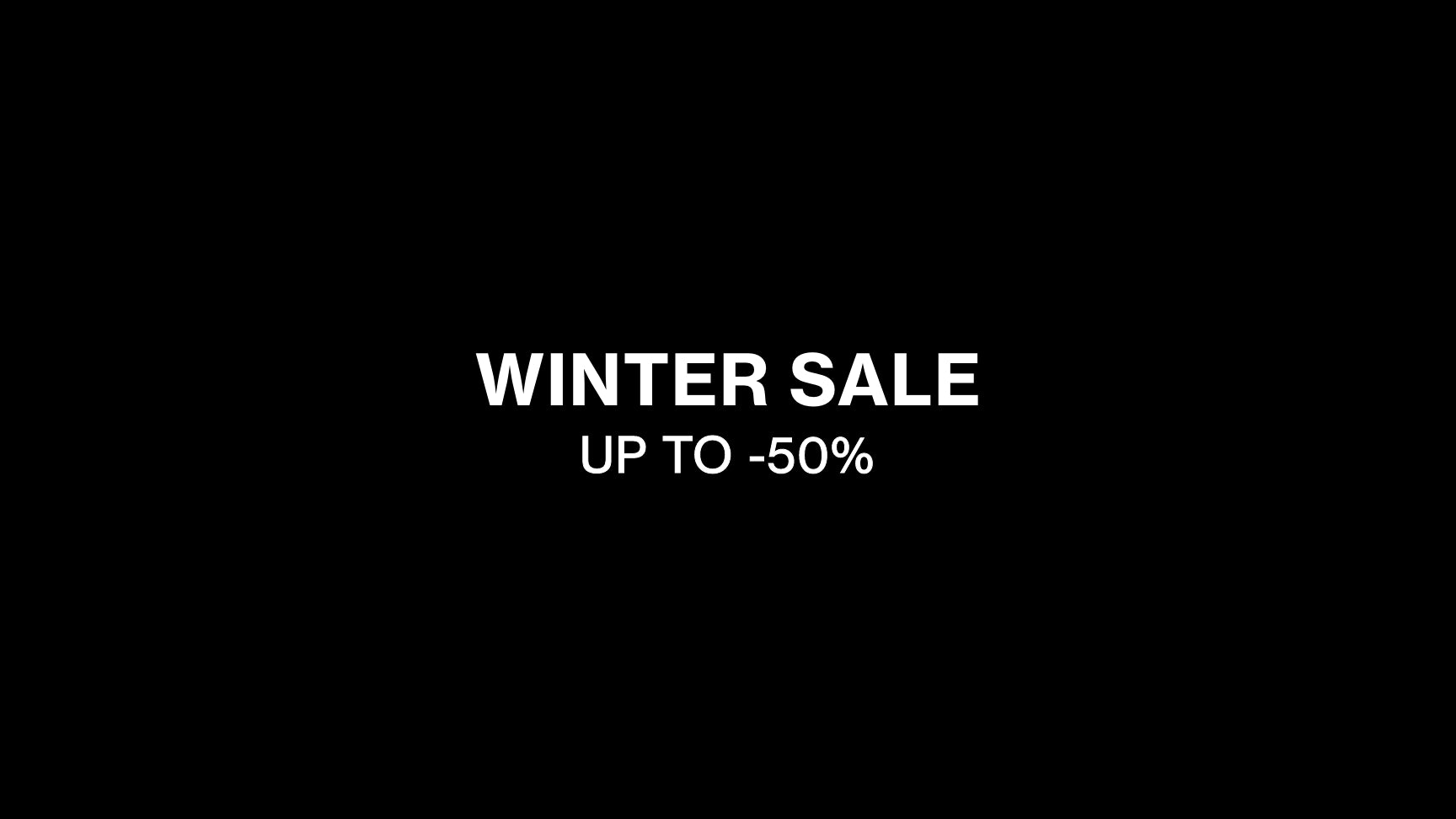Winter sale advertisement with text 'WINTER SALE UP TO -50%' on a black background