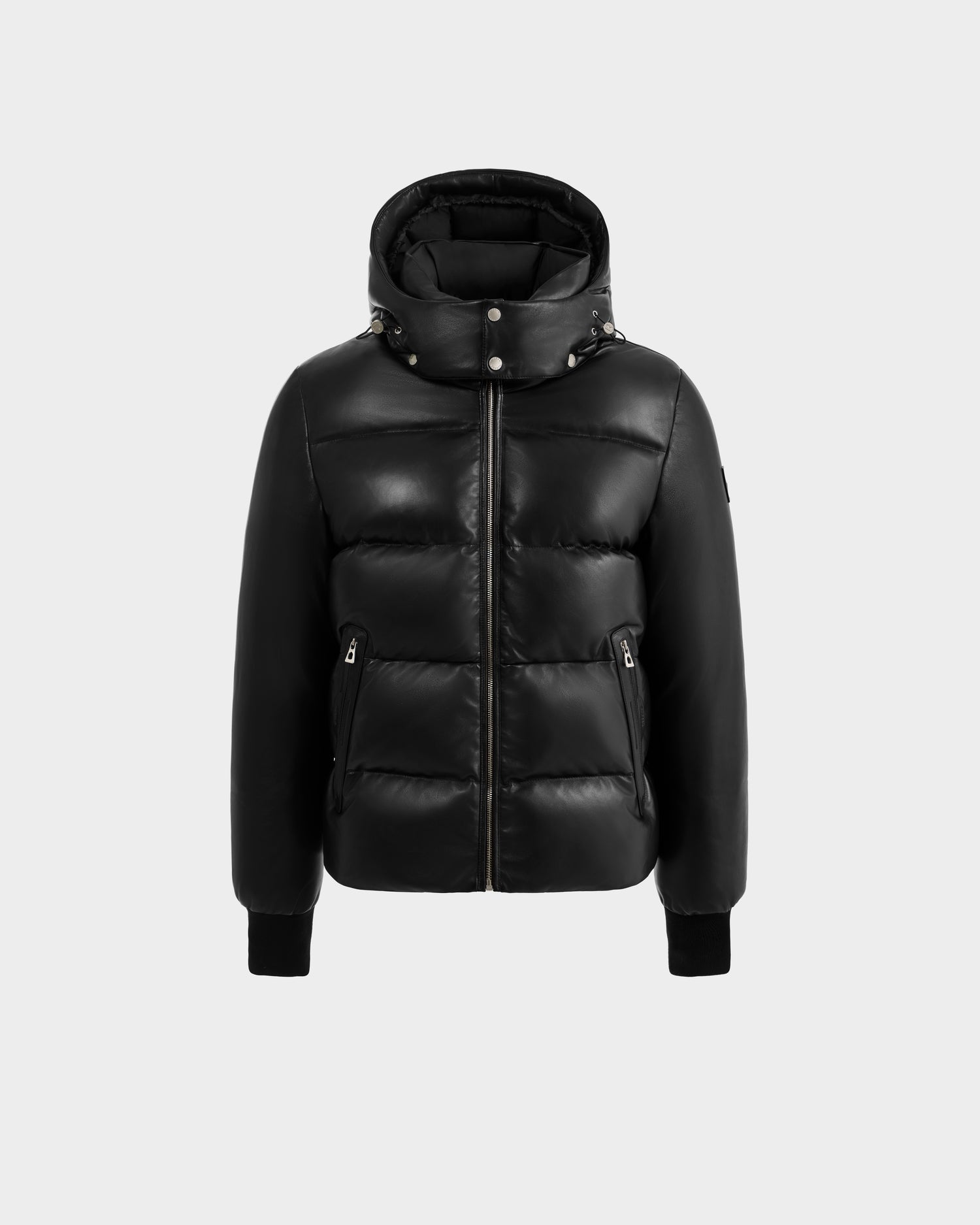 The Rudsak HARVEY X - 6125681 Black is a hooded black puffer jacket with a front zipper, collar snap buttons, zippered side pockets, ribbed cuffs, and RDS-certified down fill, shown against a plain light gray background.