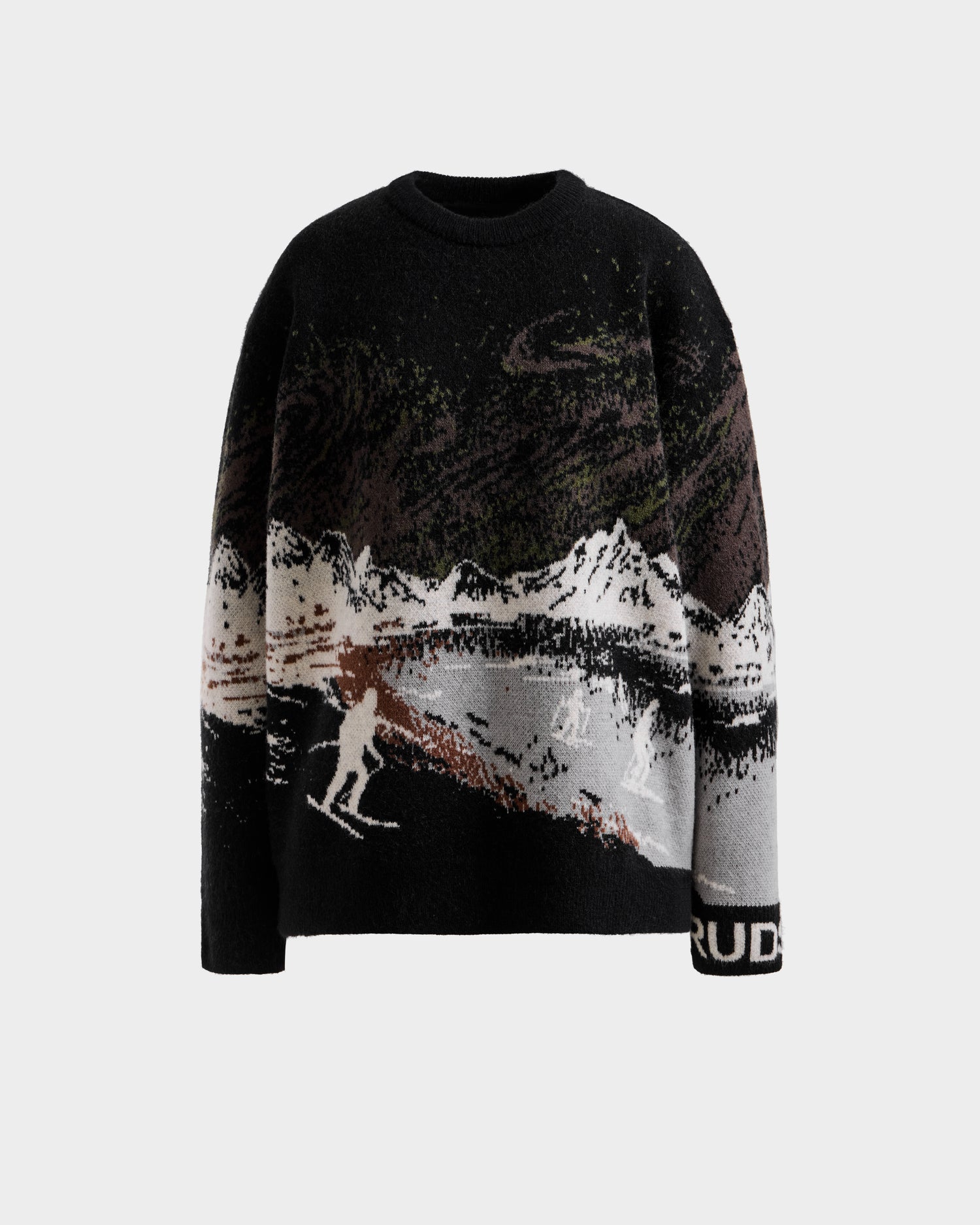 The IZZY - 9525557 Black M unisex knit sweater by Rudsak features a winter landscape with snow-capped mountains, skiers, trees, and “RUD” text on the sleeve—ideal for après-ski style.