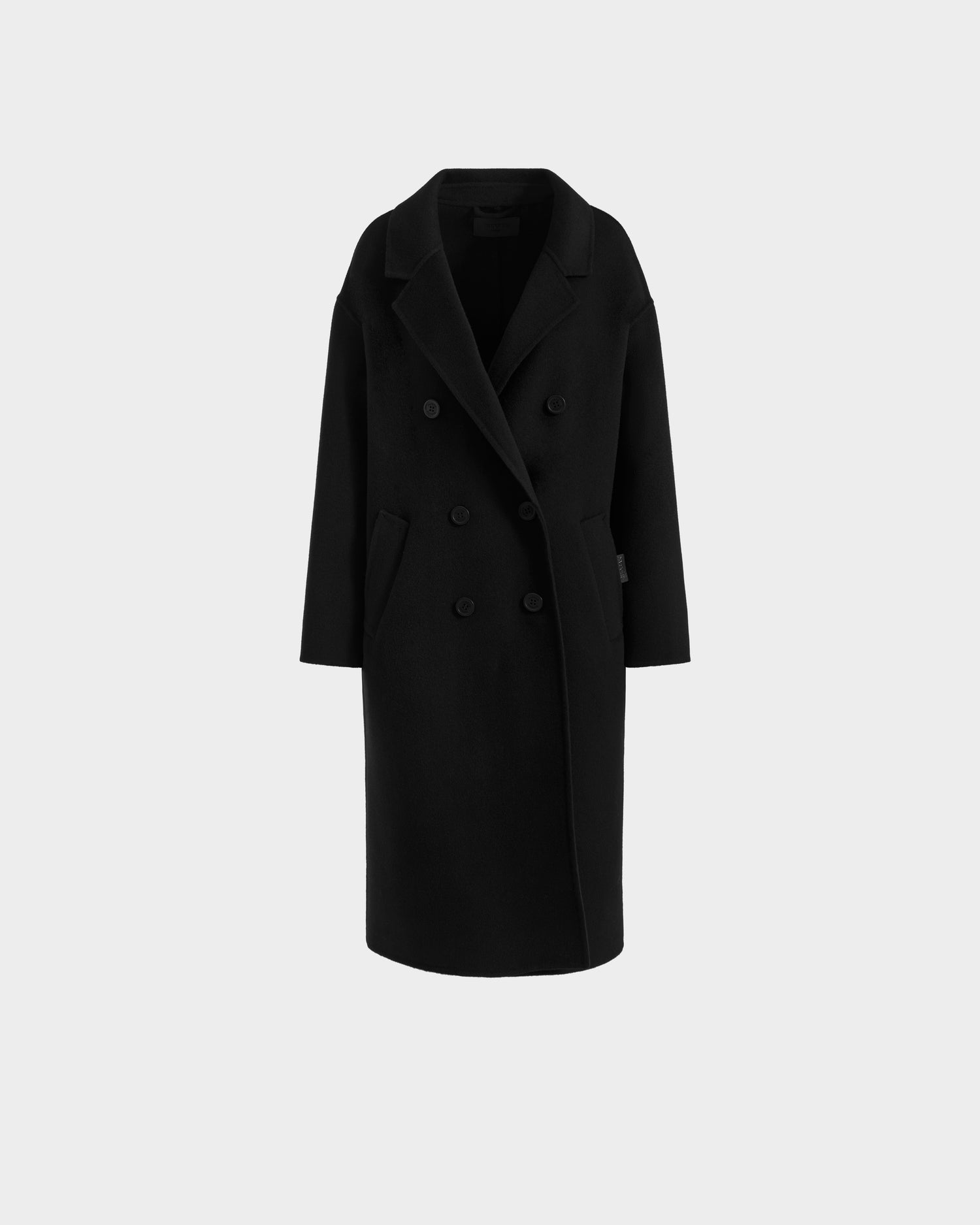 The Rudsak JADE - 8125673 Black women's wool overcoat is a long, sleek double-breasted coat with wide lapels and two rows of buttons, shown against a plain light gray background.