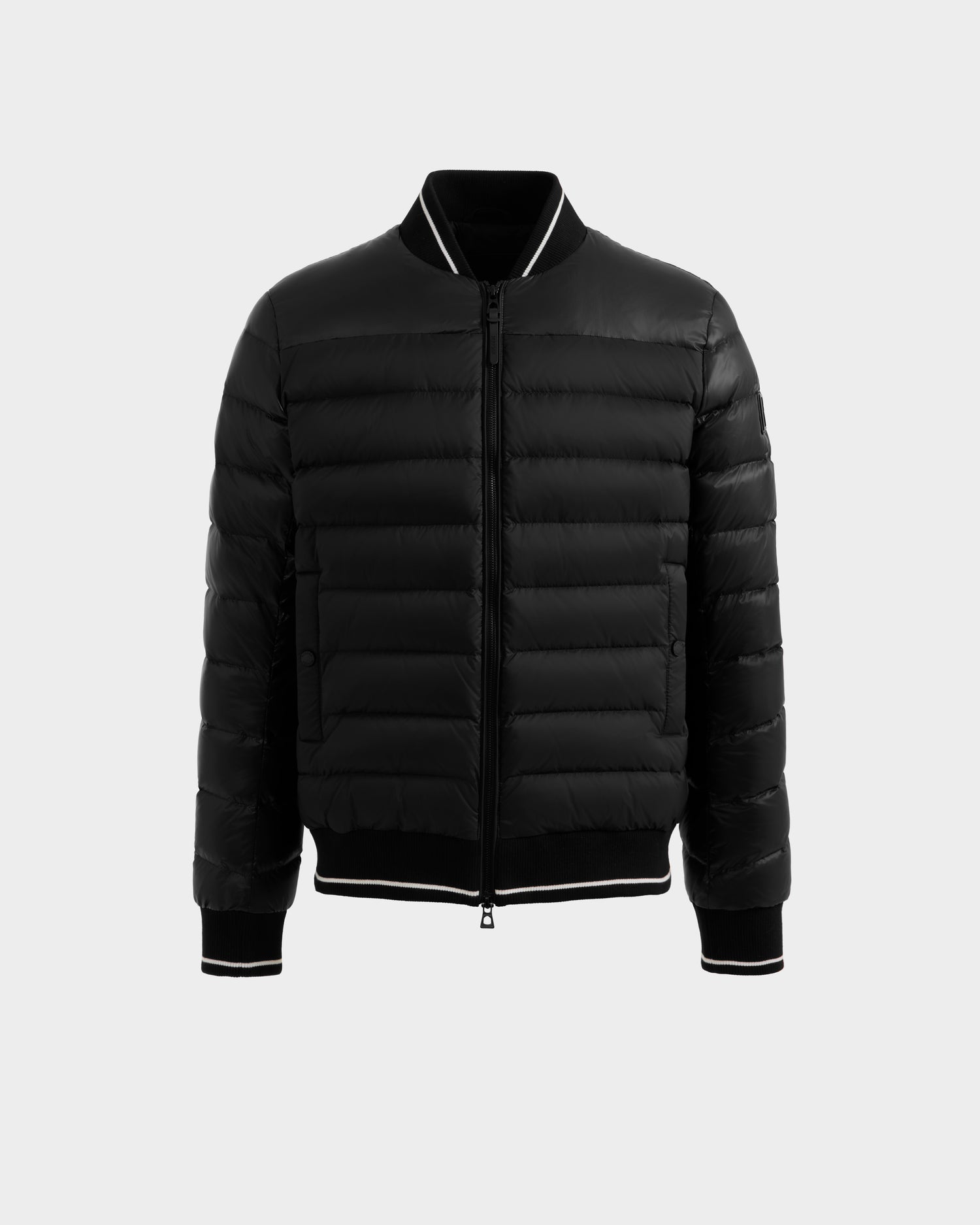 The Rudsak JEREMY - 6125025 Black men’s down bomber jacket features horizontal quilting, premium down insulation, front zipper, and ribbed cuffs and collar. Lightweight and sleek—ideal for minimalist warmth without bulk.