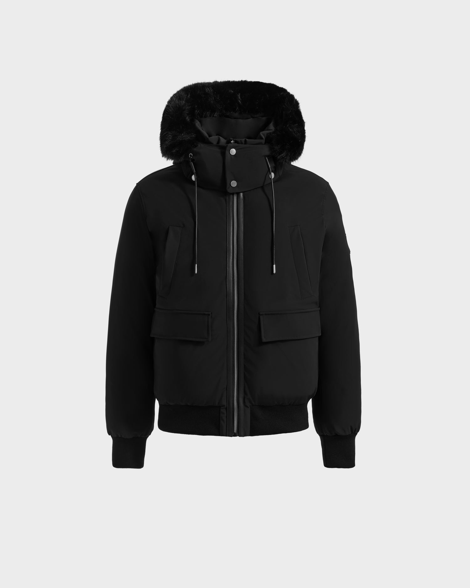 The Rudsak JEROME - 6125514 Black men’s down bomber jacket features RDS-certified down, a black fur-lined hood, front zipper, two chest and two flap pockets, plus ribbed cuffs and hem, shown on a plain light background.