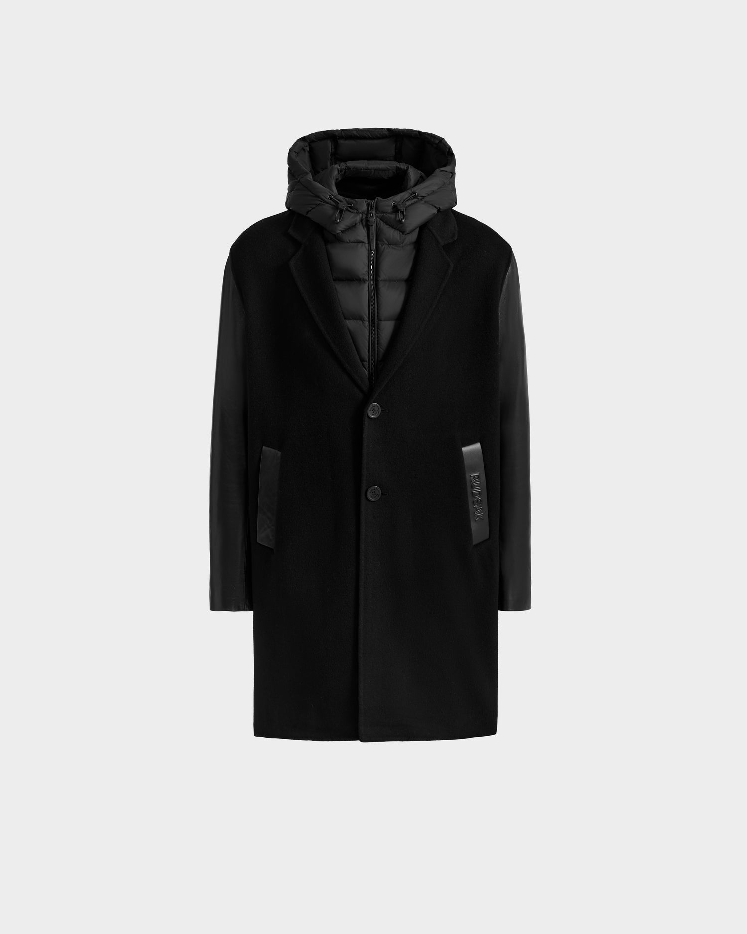The JESSE - M125504 Black by Rudsak is a men’s tailored wool coat featuring button closure, leather-look side accents, and a down-insulated hooded layer. Shown on a plain light gray background.