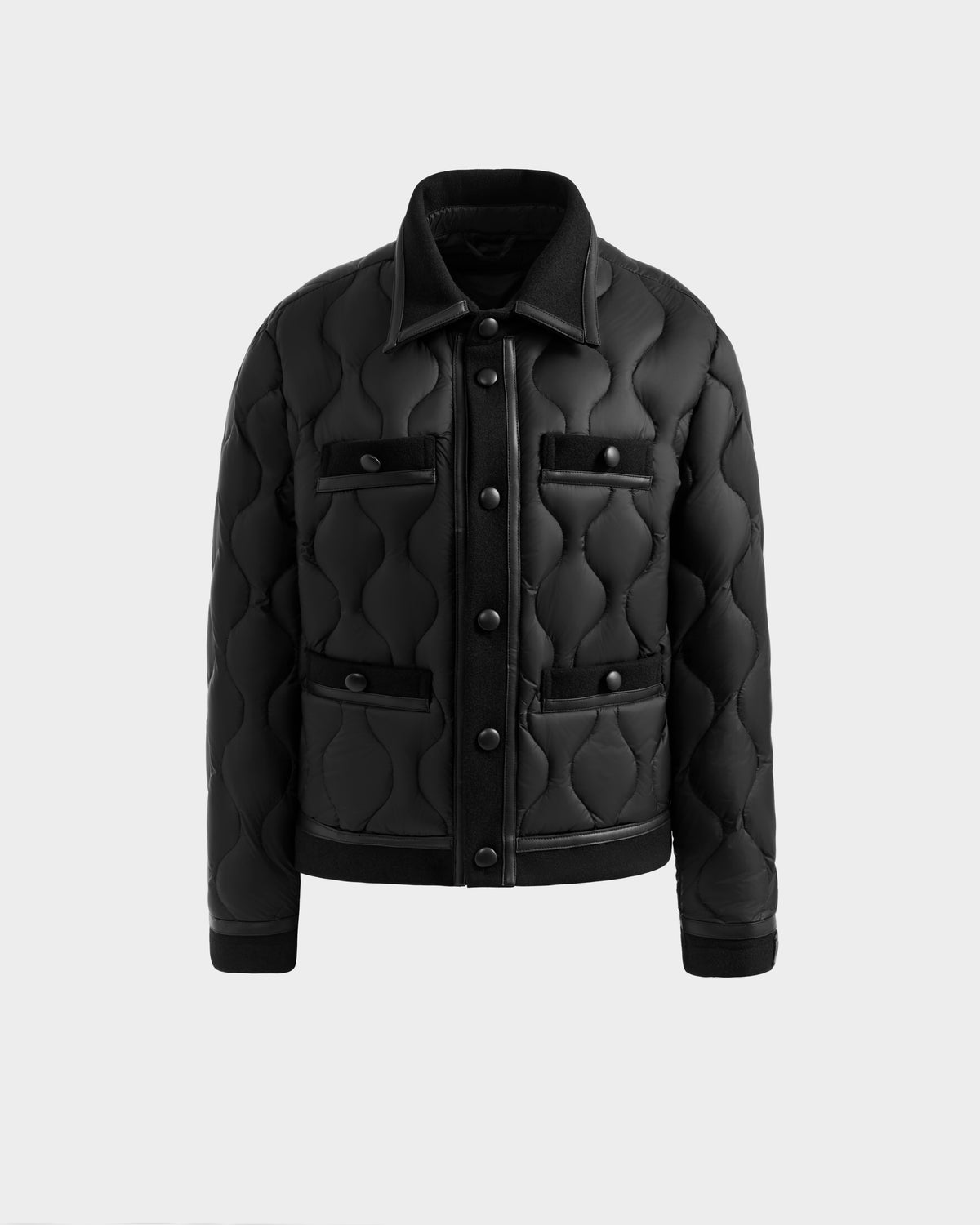 The Rudsak JOLIE - 8125036 Black women's quilted down jacket features a collar, front snap buttons, and four front pockets, shown on a plain light gray background.