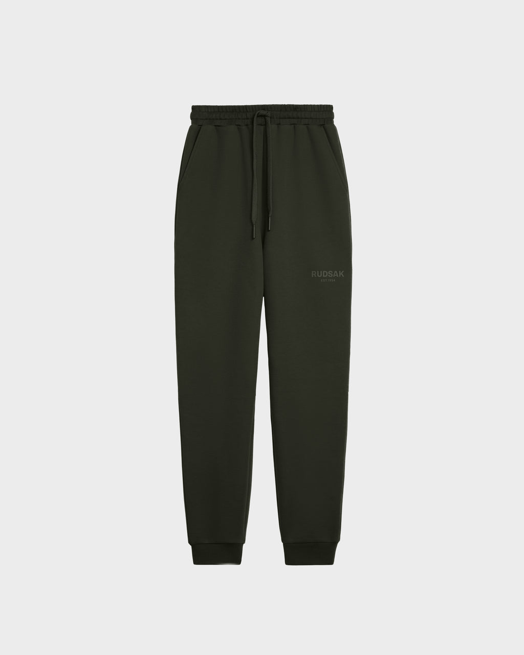The Rudsak JOSS - 9524009 joggers in dark olive (size M) feature premium cotton, an elastic waistband with drawstring, side pockets, cuffed ankles, and a subtle logo on the upper left thigh, shown against a plain white background.