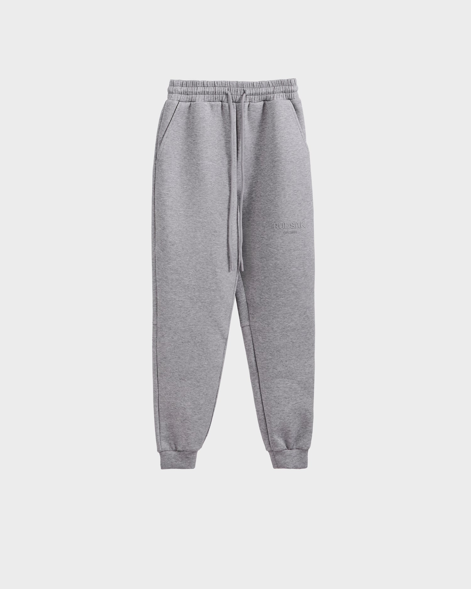 Rudsak JOSS - 9524009 Heather Grey M unisex jogger sweatpants feature an elastic waistband, drawstring, side pockets, and cuffed ankles in premium cotton, shown against a plain white background.