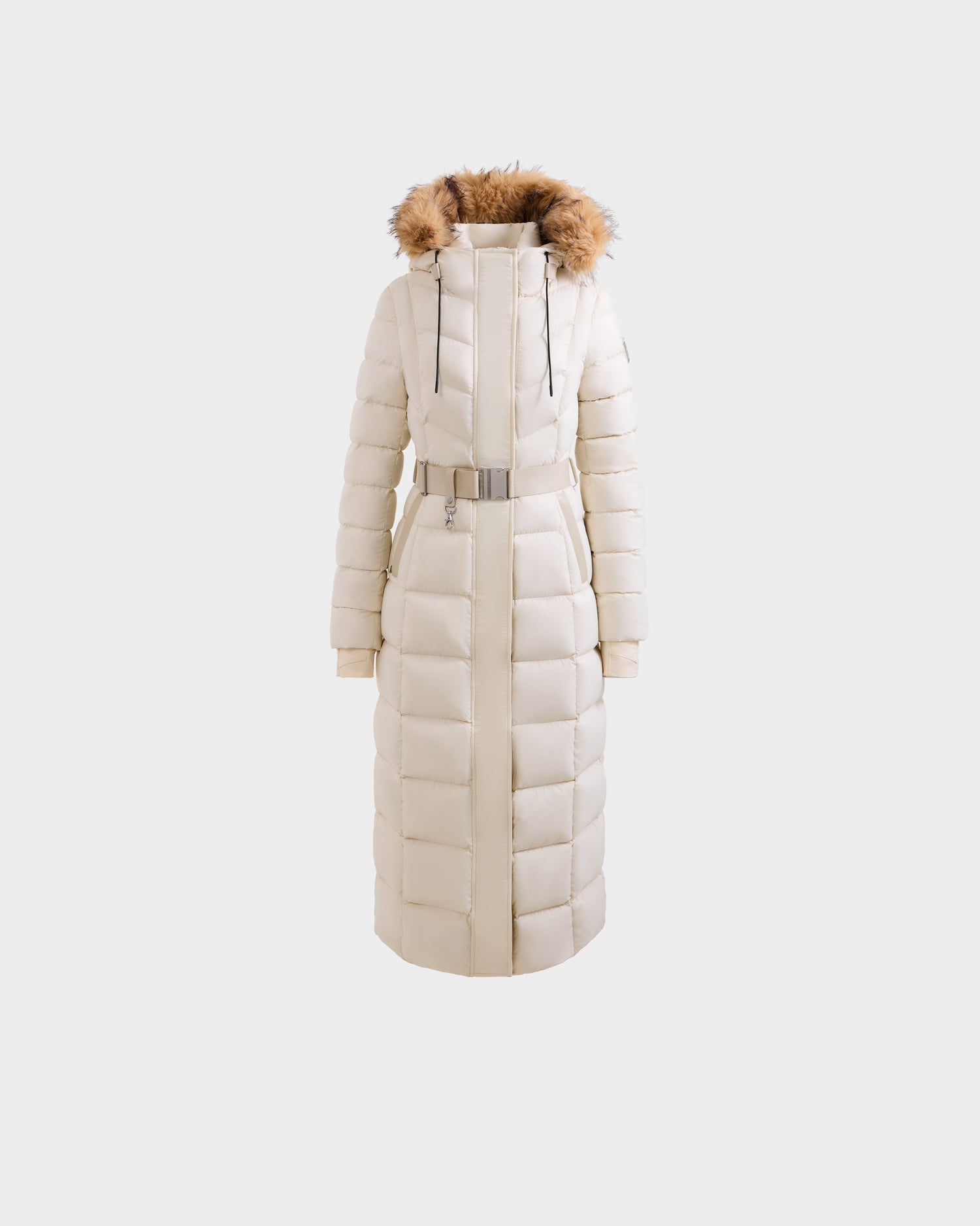 The Rudsak JULIETA M-L - L125559 Vanilla is a cream maxi down puffer with a belted waist, front zipper, and brown faux fur-trimmed hood, shown against a plain white background.
