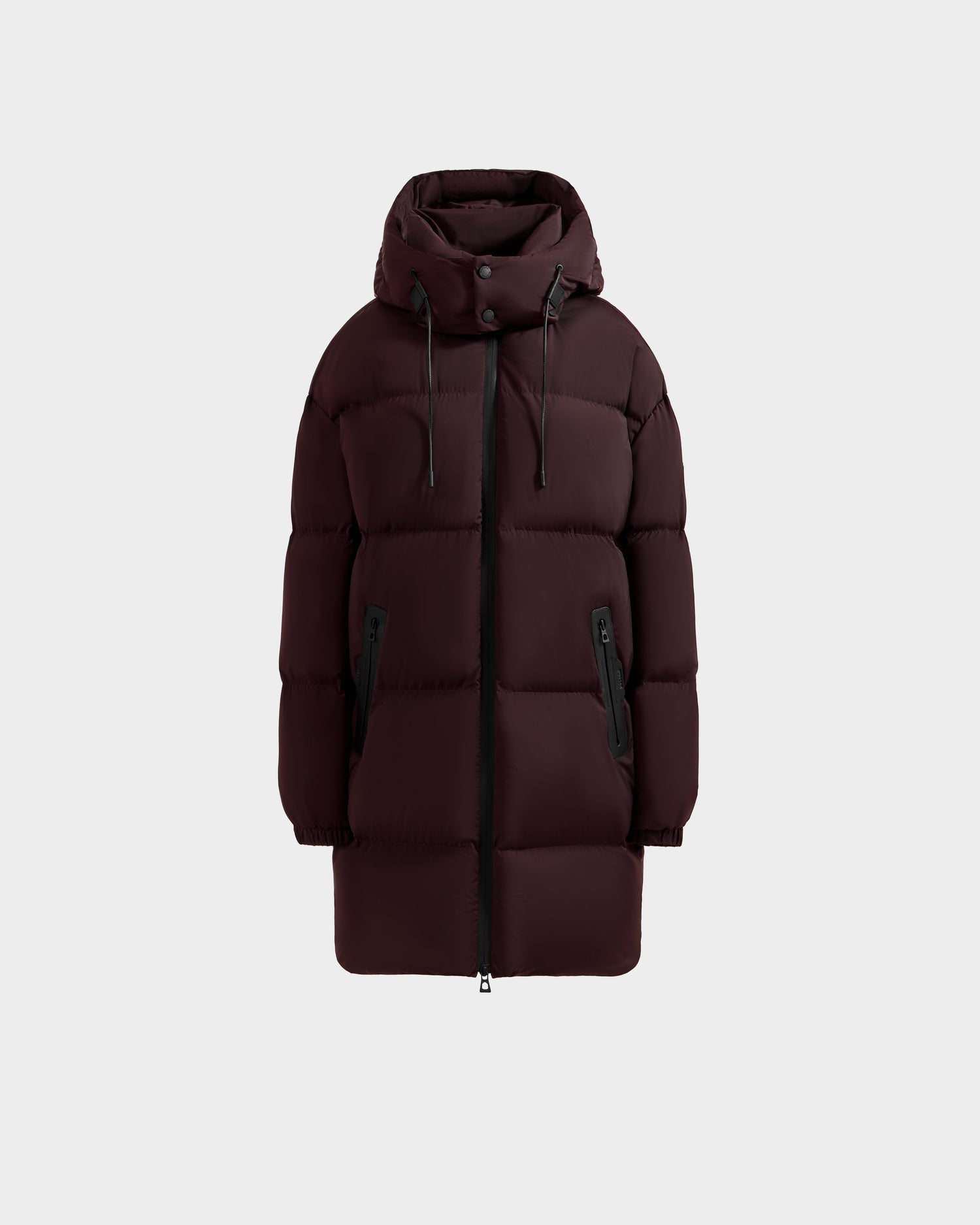 The Rudsak KARLEE L - 8125682 Bordeaux is a women's long puffer down winter jacket in dark burgundy with a hood, front zipper, snap buttons, vegan leather trim, and two zippered side pockets, shown on a light gray background.