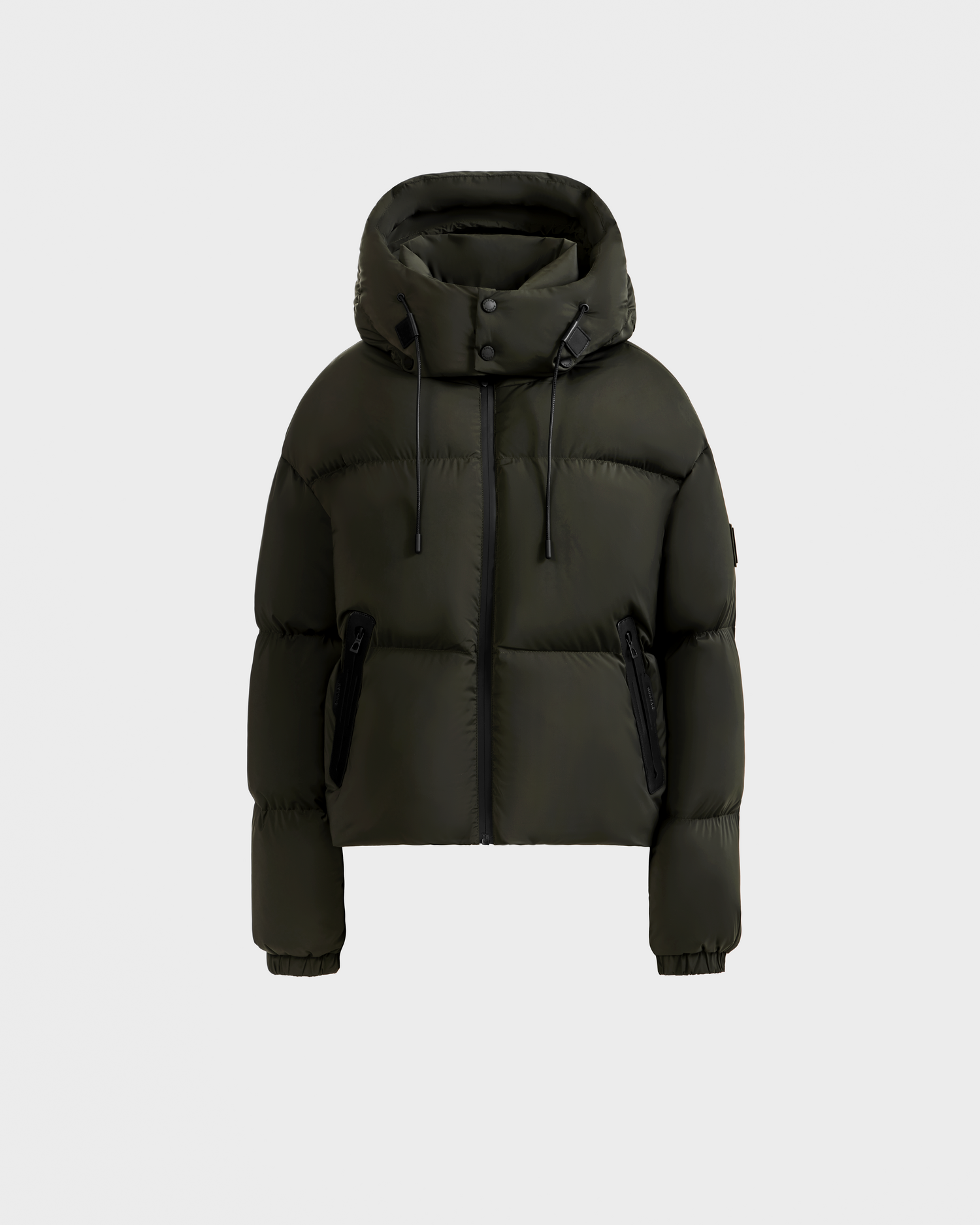 The Rudsak KARLEE S - 8125699 Dark Olive women’s down puffer jacket features a hood, front zipper, drawstrings, zippered side pockets, and elastic cuffs—an ideal cold-weather essential shown on a light gray background.