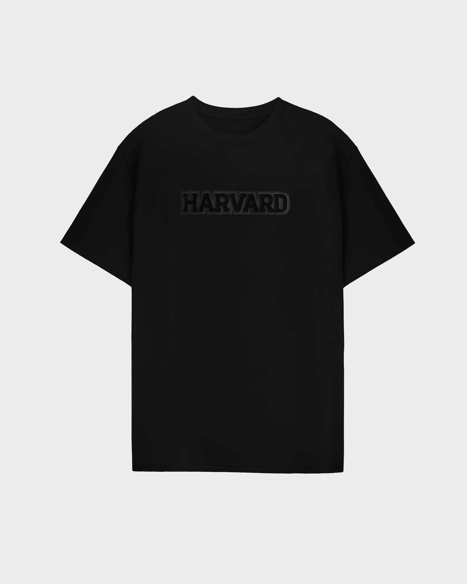 The KARTER B HV - H525508 Black t-shirt by Rudsak features short sleeves and bold uppercase HARVARD lettering across the chest, standing out against a light gray background.