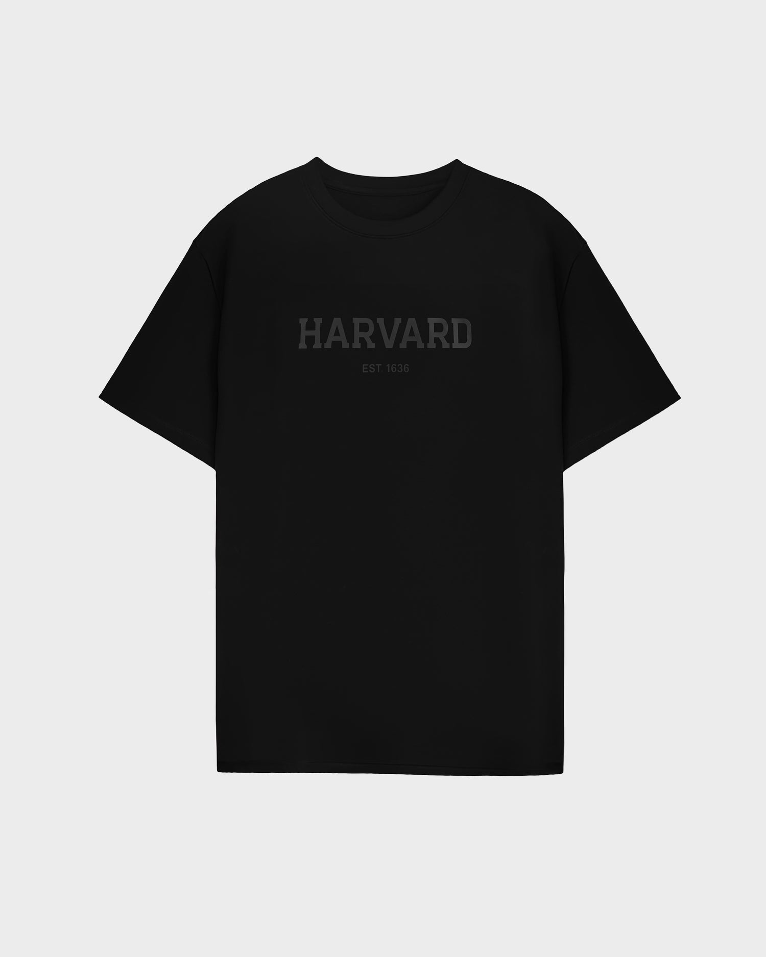 The KARTER R HV - H525507 Black T-shirt by Rudsak features HARVARD and EST. 1636 in dark lettering on the front—an essential, minimalist piece perfect for any streetwear collection.