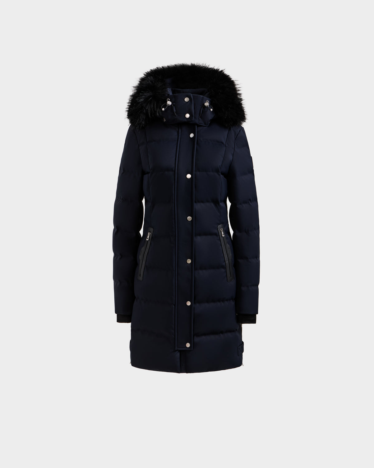 The Rudsak KEHLANI H - 8125643 Navy is a long women’s down parka with a front zipper, snap buttons, zippered pockets, and a black faux fur-trimmed hood, made with RDS-certified down and shown on a plain light background.