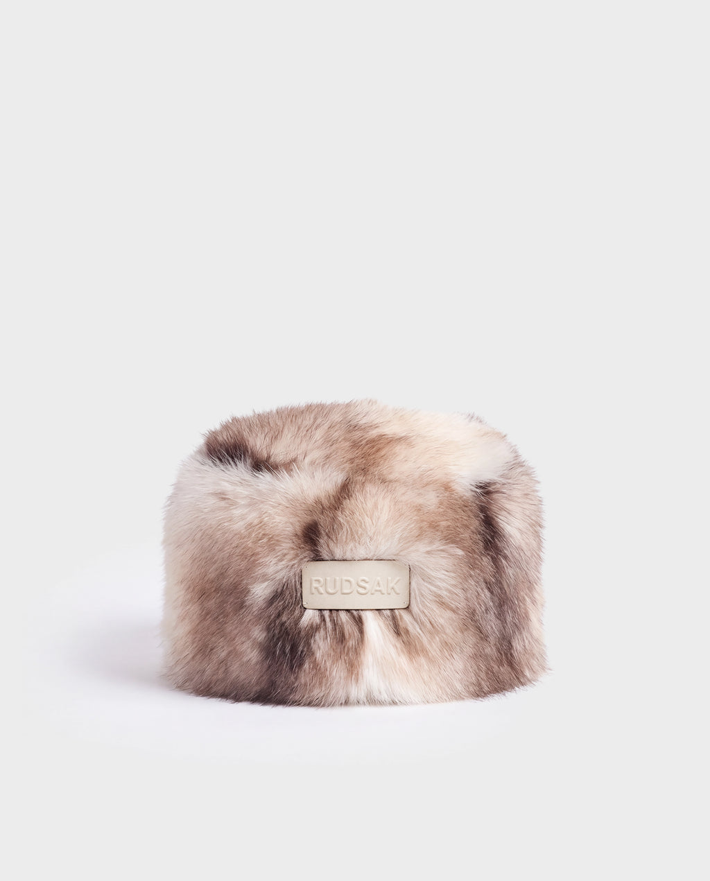 Rudsak LORETTA - 8426503 Mix Vanilla cylindrical faux fur hat in a cream and brown blend with a branded leather tab on the front.