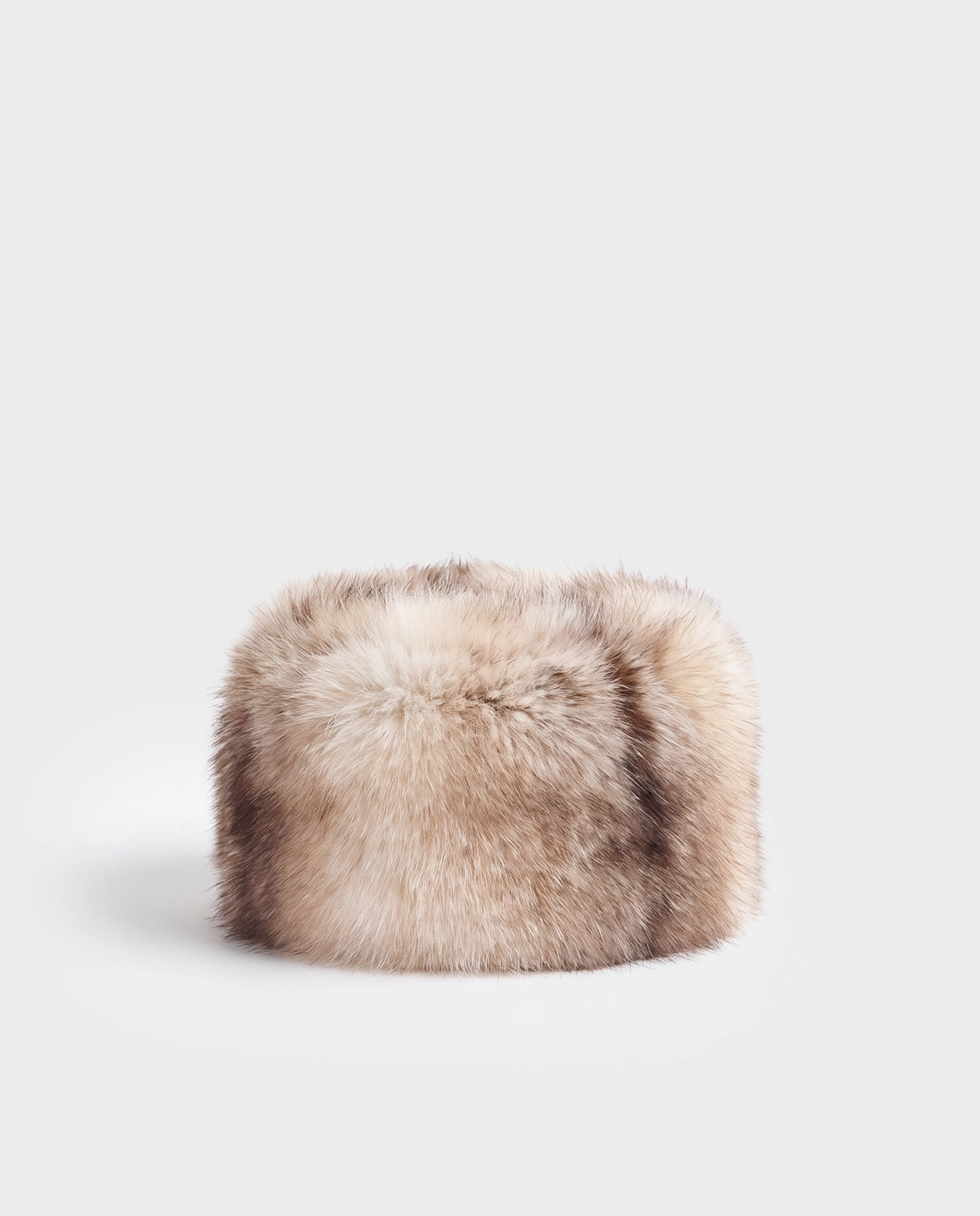 A cylindrical LORETTA - 8426503 Mix Vanilla faux fur headband in light brown and white.
