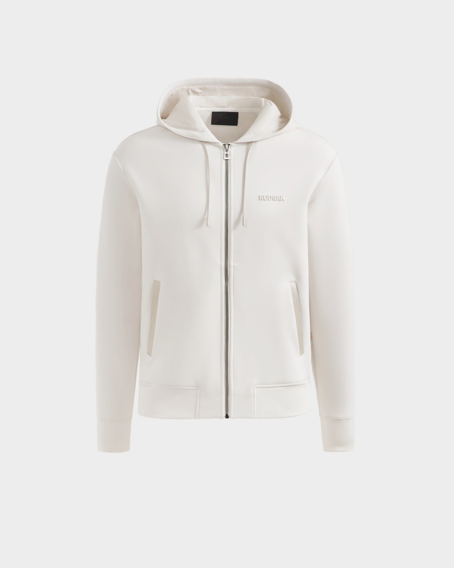 A plain white unisex zip-up hoodie, LEVI - 9525552 Vanilla M by Rudsak, with a hood and front pockets, shown on a light gray background—an elevated wardrobe essential.
