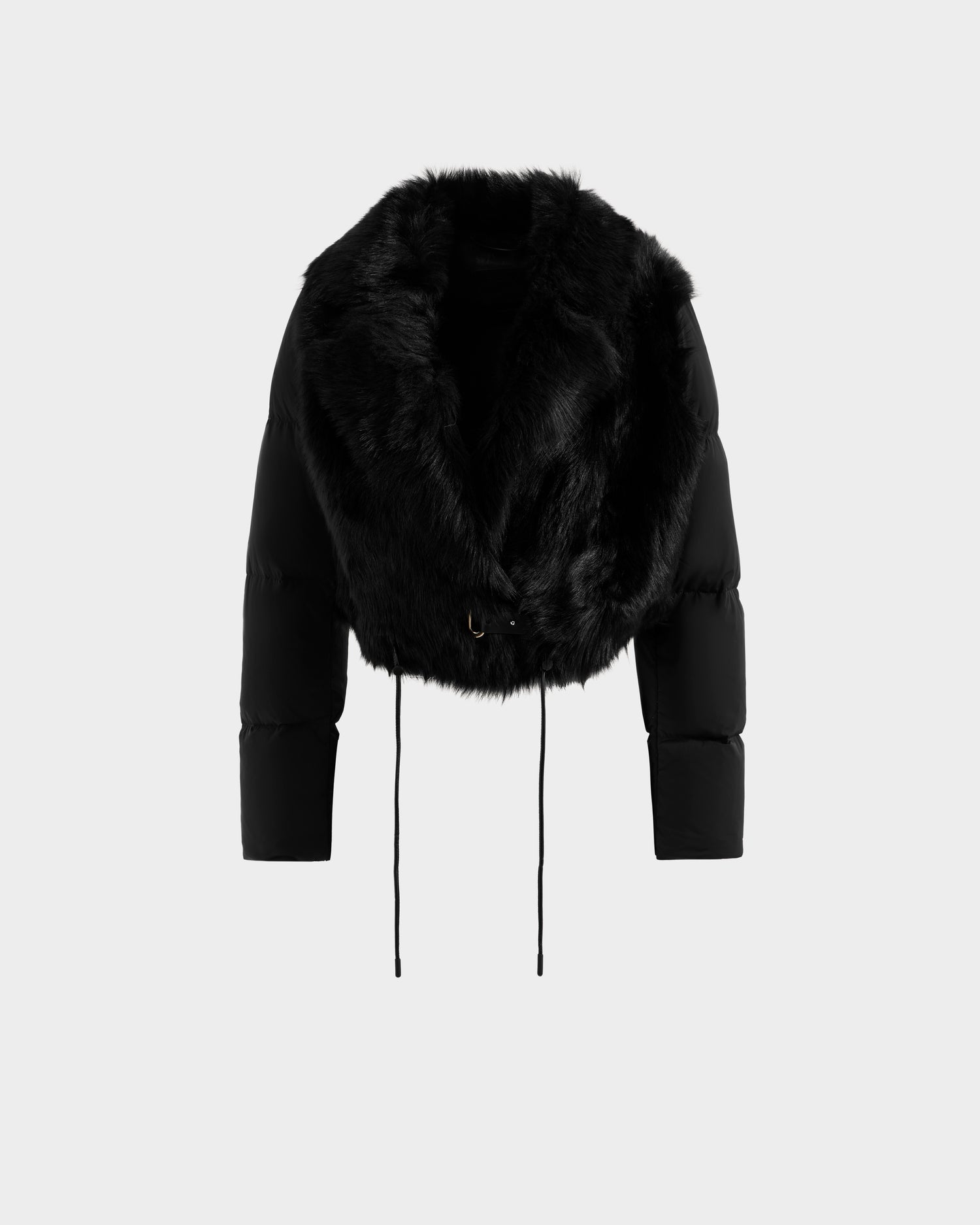The Rudsak LILAH - 8125509 Black is a women’s cropped jacket with puffer sleeves, a large faux fur collar, long sleeves, and bottom drawstrings, shown on a plain white background.