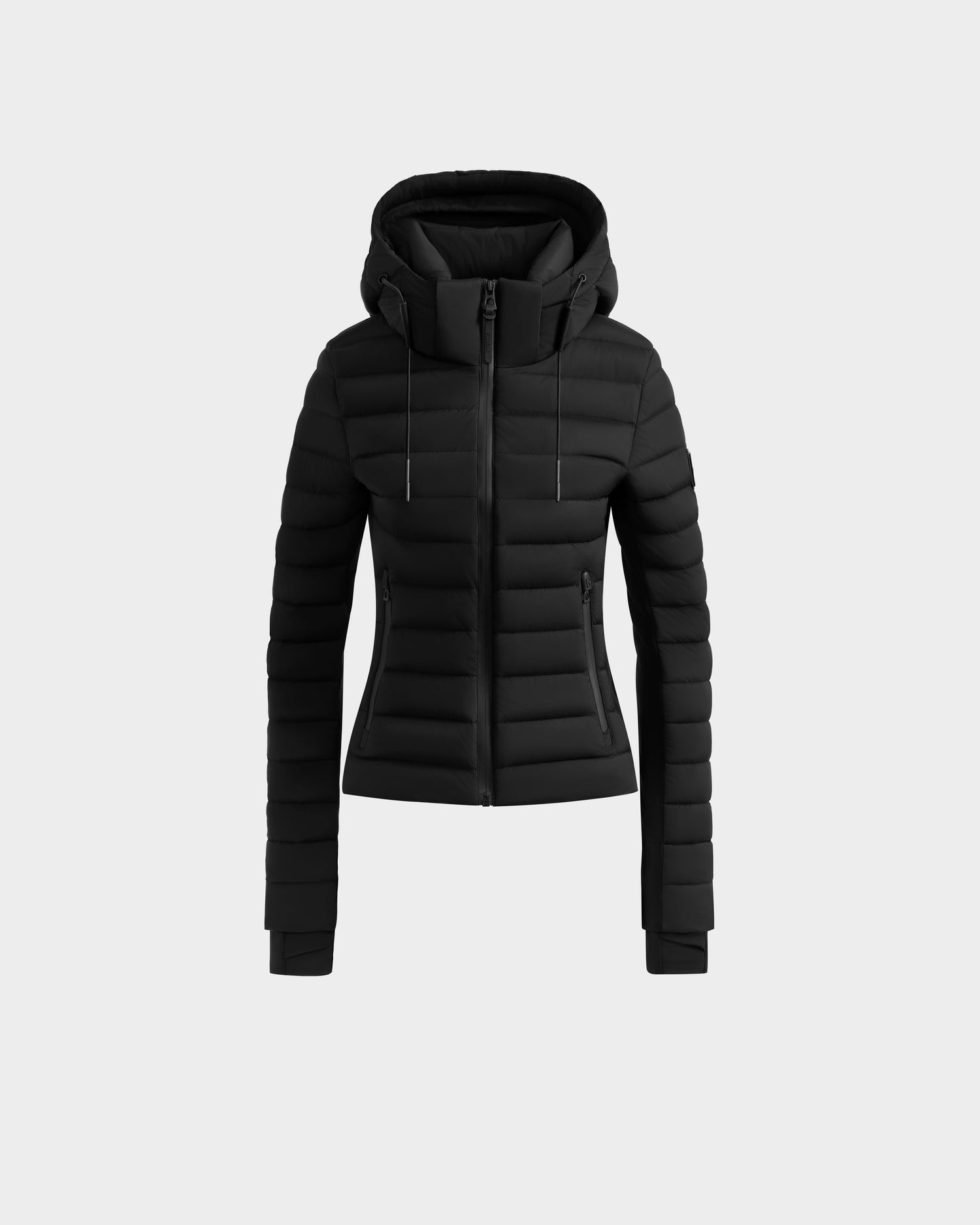 The Rudsak MARYA M - L125509 Black women’s down puffer features an RDS certified black fitted quilted design with a front zipper, side pockets, and attached hood, shown on a plain light gray background.