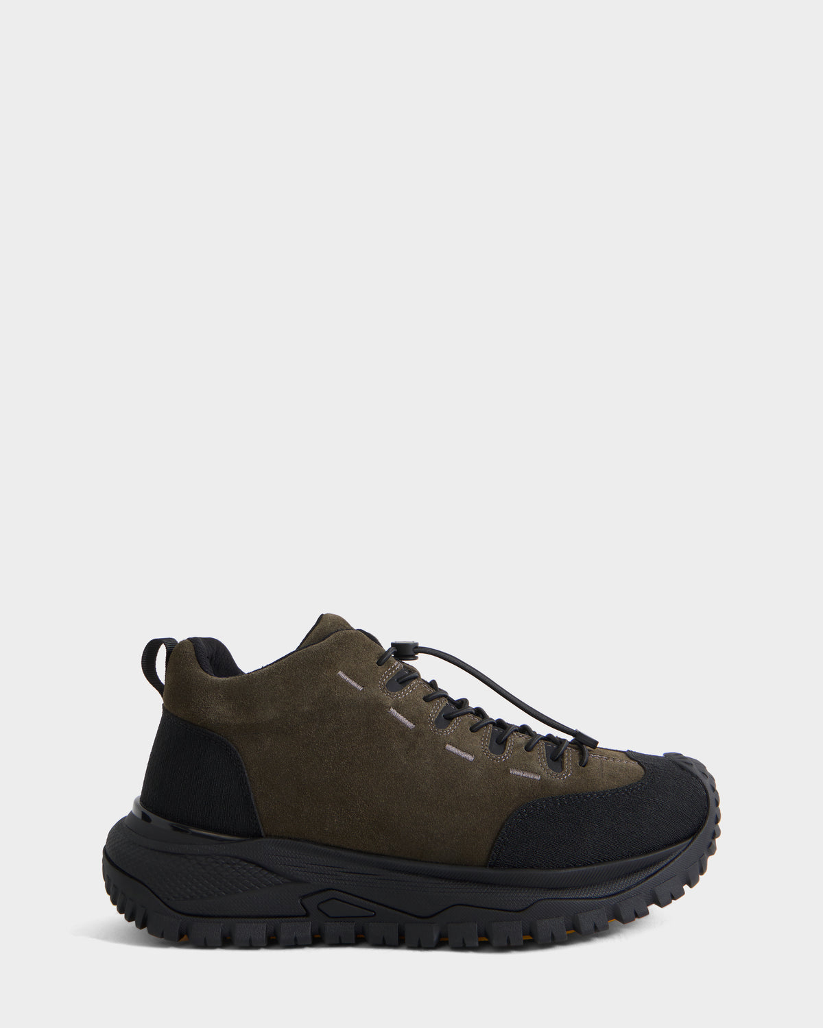 The Rudsak MAX S - 6226505 Olive is a dark green and black, trail-inspired sneaker featuring a thick textured sole, black laces, and a low-cut ankle, displayed on a white background.