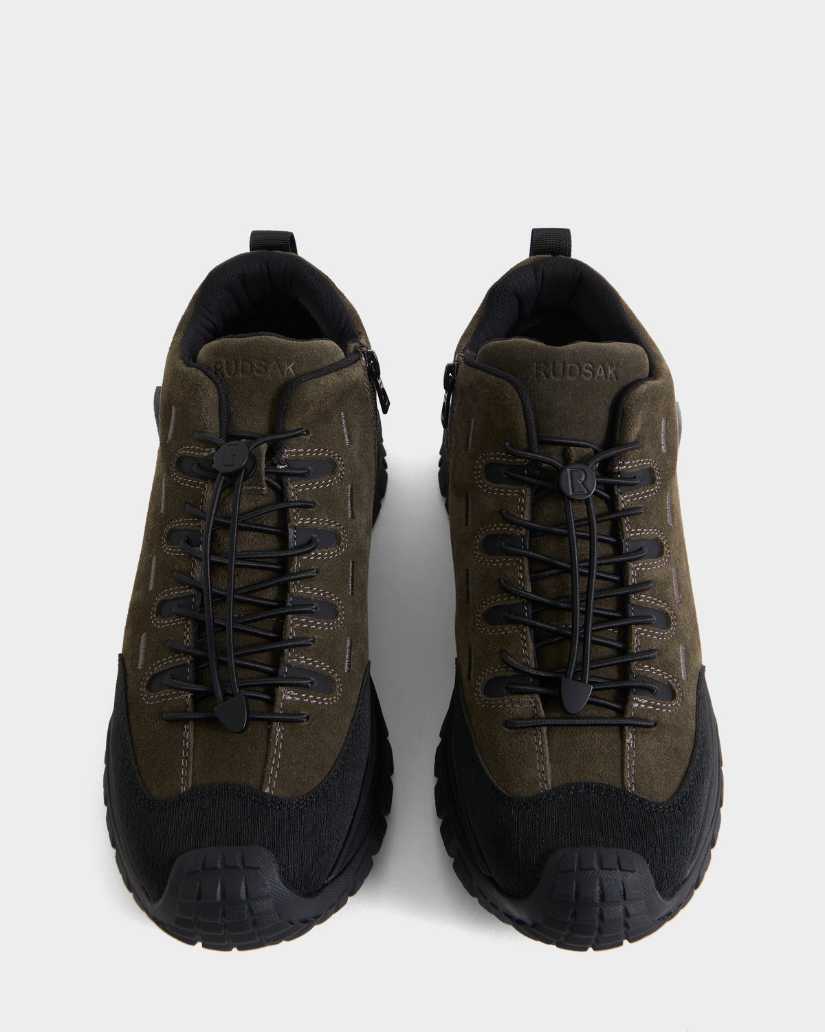 A pair of Rudsak MAX S - 6226505 Olive sneakers in dark green and black suede, featuring thick rubber soles and lace-up fronts, viewed from above on a white background.