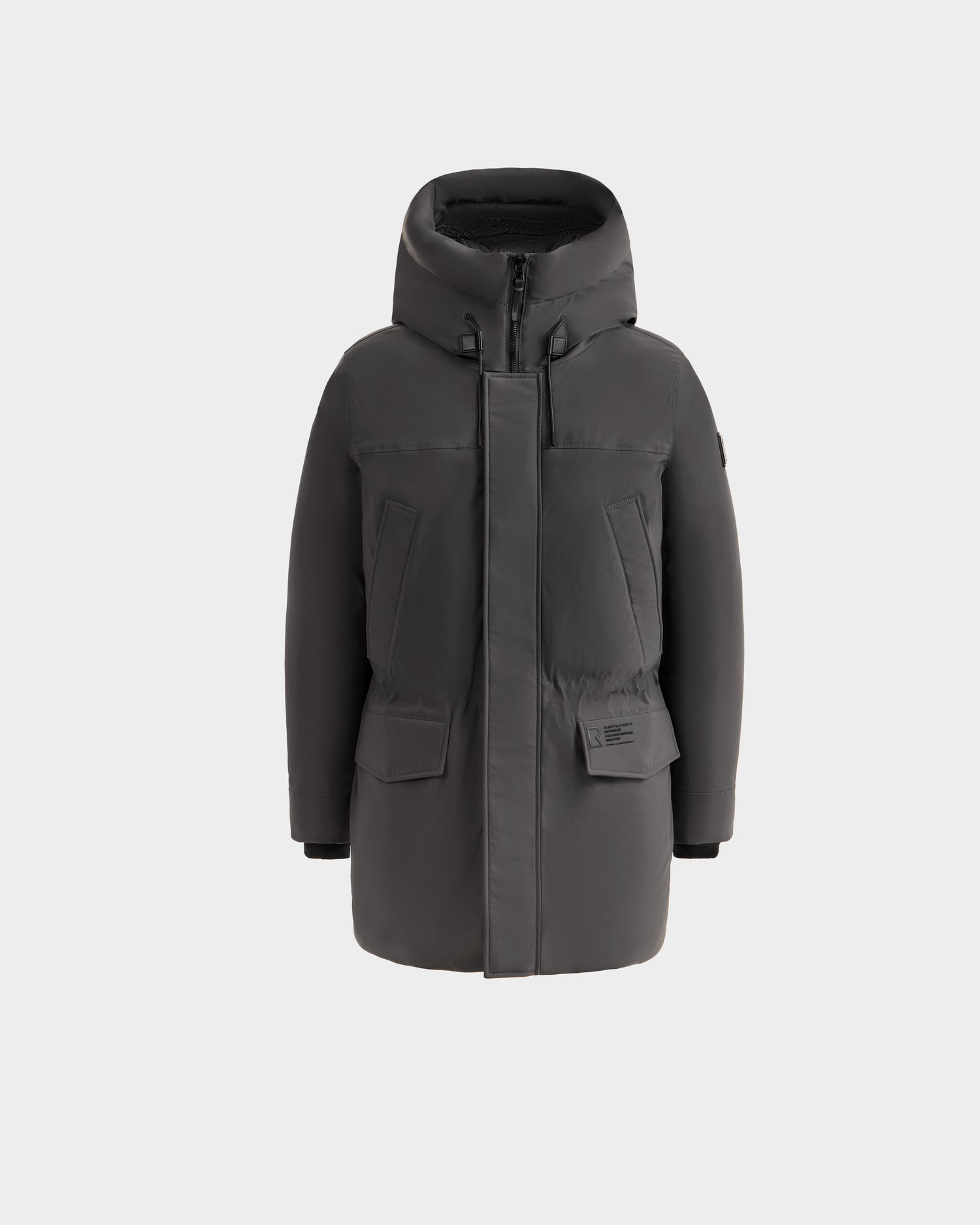 The Rudsak MITCHELL - M125513 Grey is a men’s dark gray down parka with RDS-certified down, a hood, zipper and snap closures, large front pockets, and a smooth matte finish, shown on a plain white background.