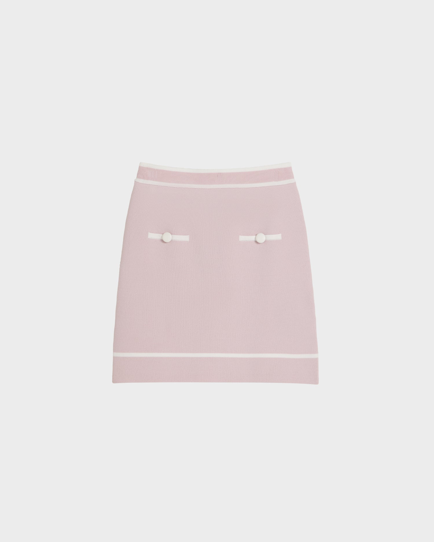 The NAPA - 8525083 Light Pink mini skirt by Rudsak is a fitted women’s knit design with white trim on the waistband and hem, two decorative front pockets with statement buttons, and horizontal white bands, shown on a plain white background.