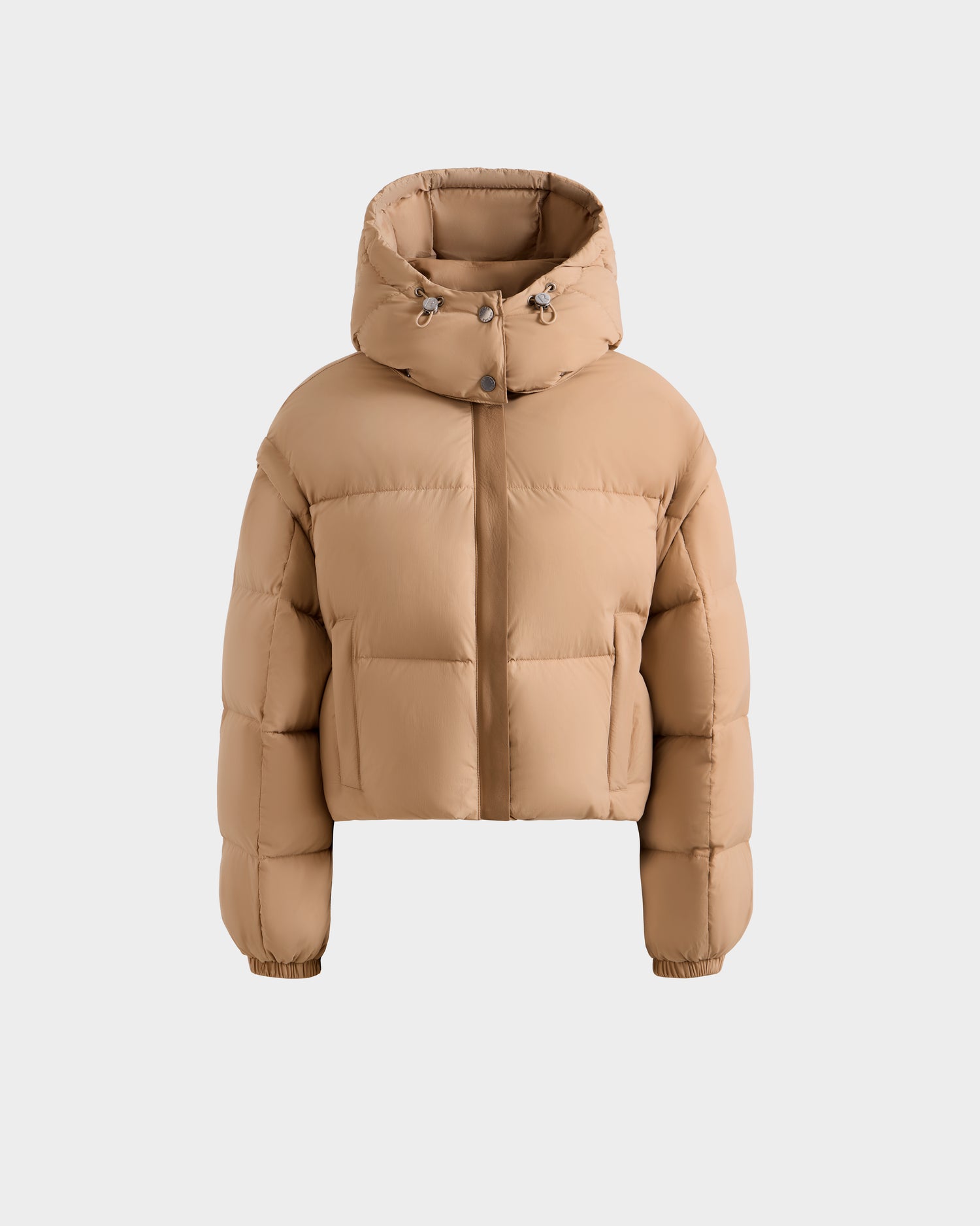 The Rudsak OPRAH - L125546 Vanilla is a women's tan cropped down puffer jacket with a hood, front zipper and snap closure, RDS-certified down, two front pockets, elasticized cuffs, and boxy fit. Shown on a plain white background.