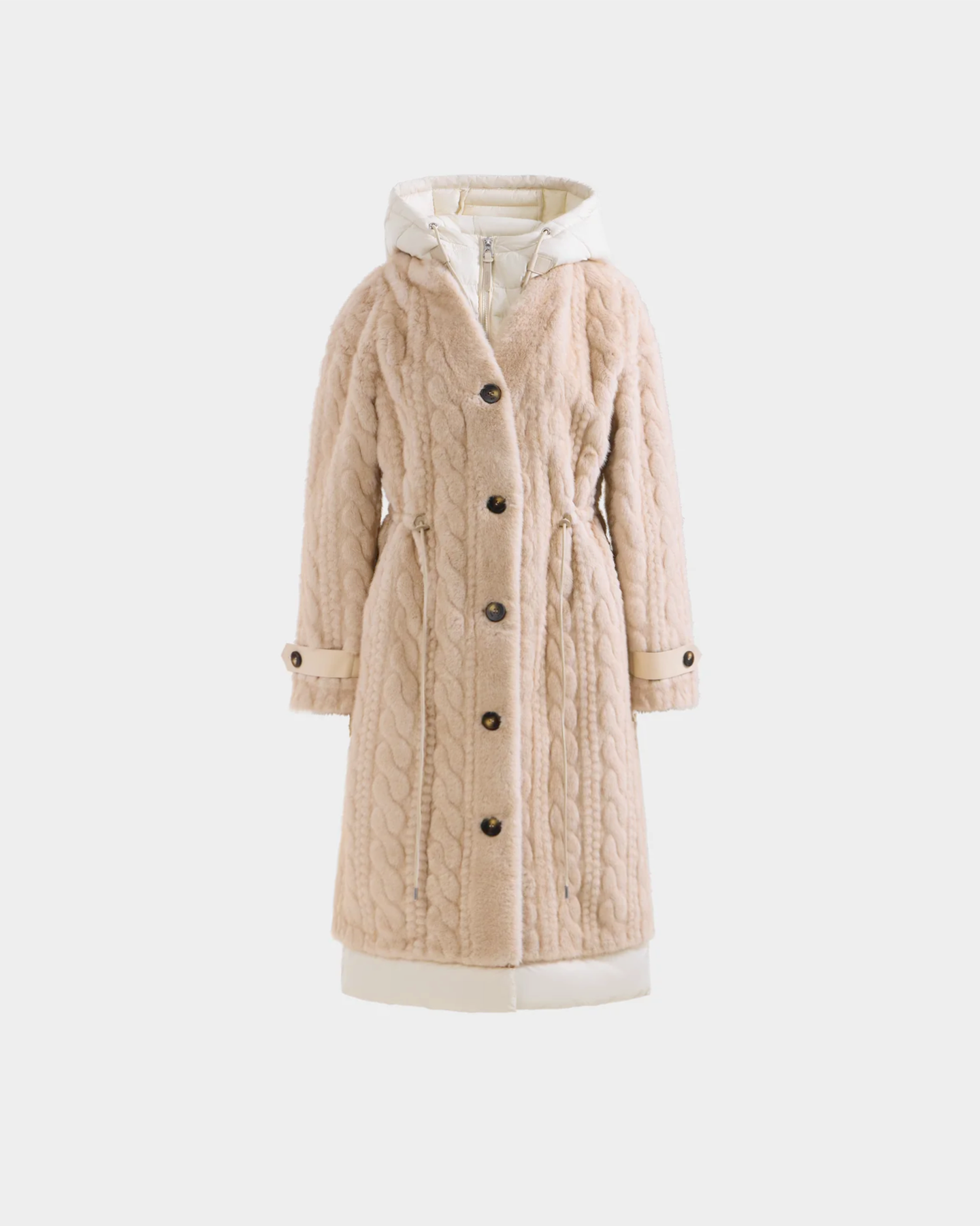 The Rudsak ORIANA - 8125545 Vanilla is a beige, knee-length cable knit coat with a button-down front, waist cinching, vegan leather trim, and cream cuffs and hem, shown against a plain white background.