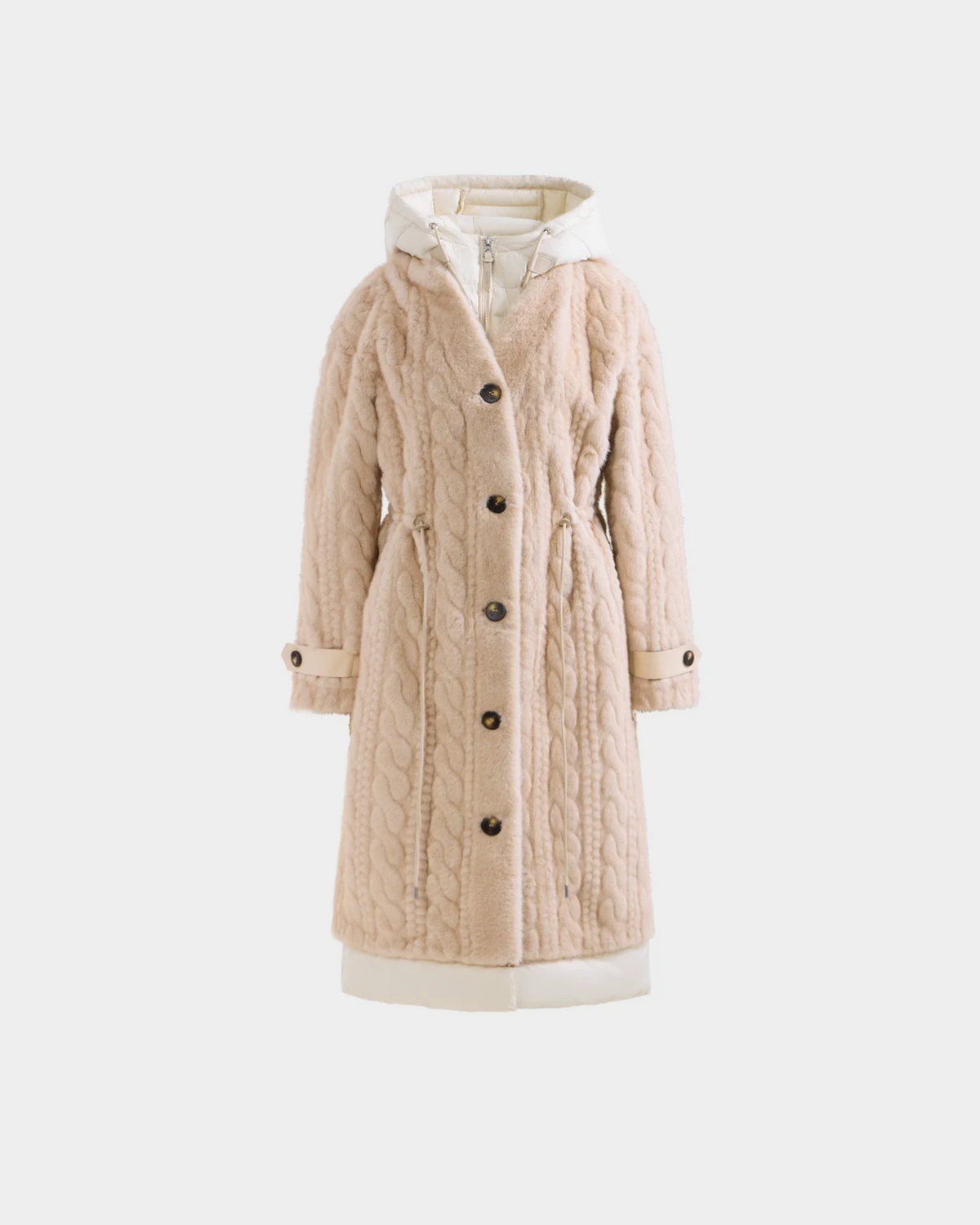 The Rudsak ORIANA - 8125545 Vanilla is a beige, knee-length cable knit coat with a button-down front, waist cinching, vegan leather trim, and cream cuffs and hem, shown against a plain white background.