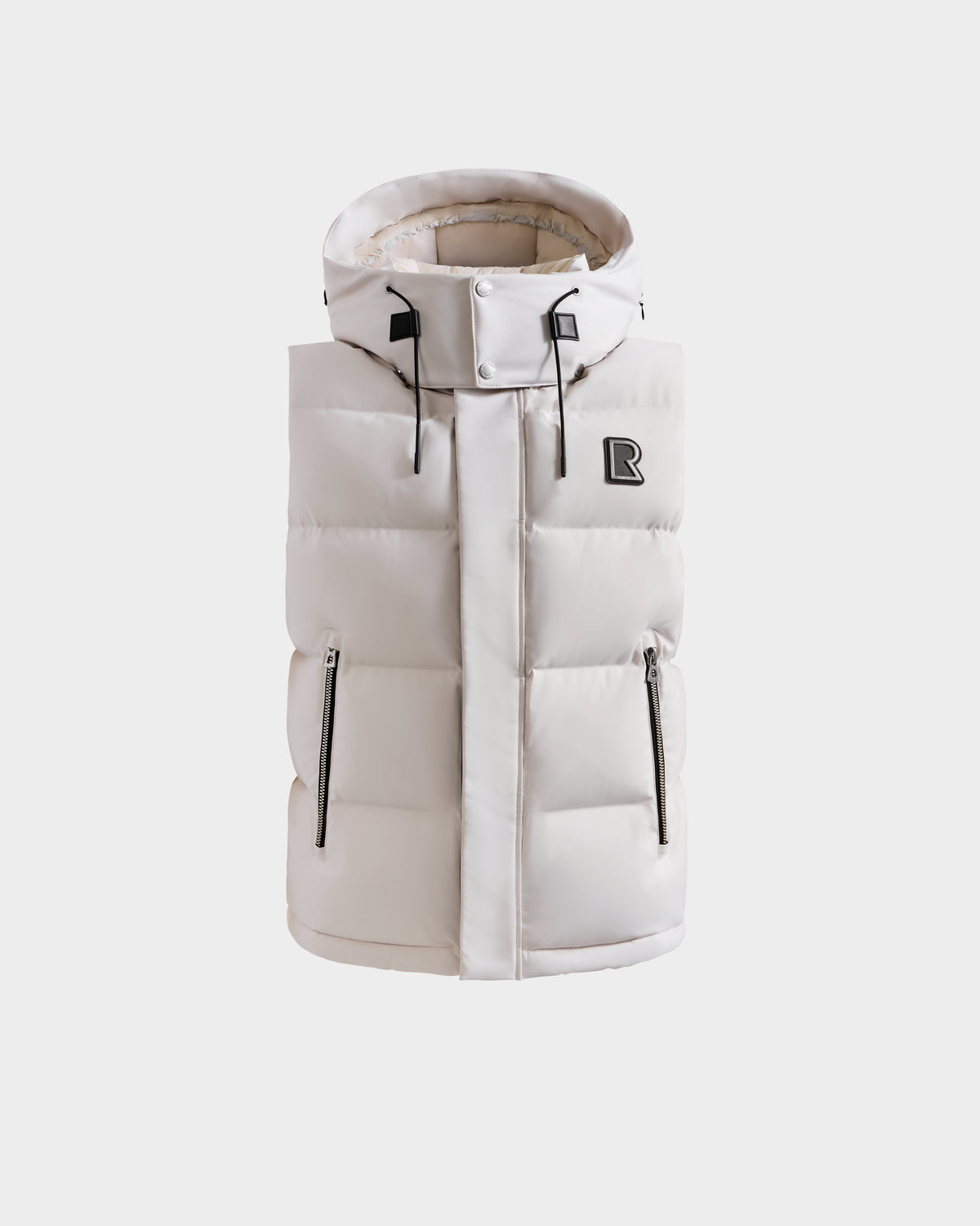 The REN H - 6125688 Vanilla by Rudsak is a sleeveless, off-white quilted down vest with a high collar, removable hood, two zippered side pockets, and a black R logo patch on the left chest, shown on a plain white background.