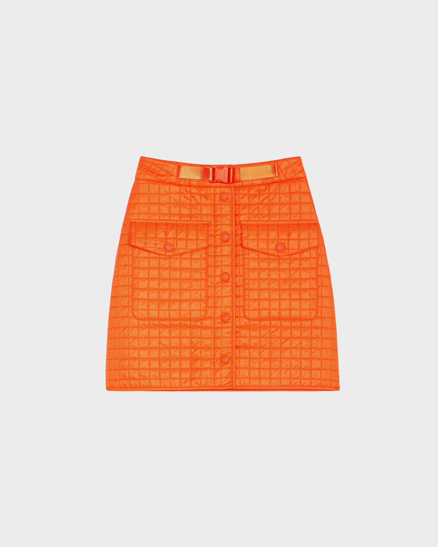 The SABINE - 8524063 Orange Sorbet quilted short skirt by Rudsak features a front button closure, two large front pockets, and a matching belt—a bold women's statement piece shown on a white background.